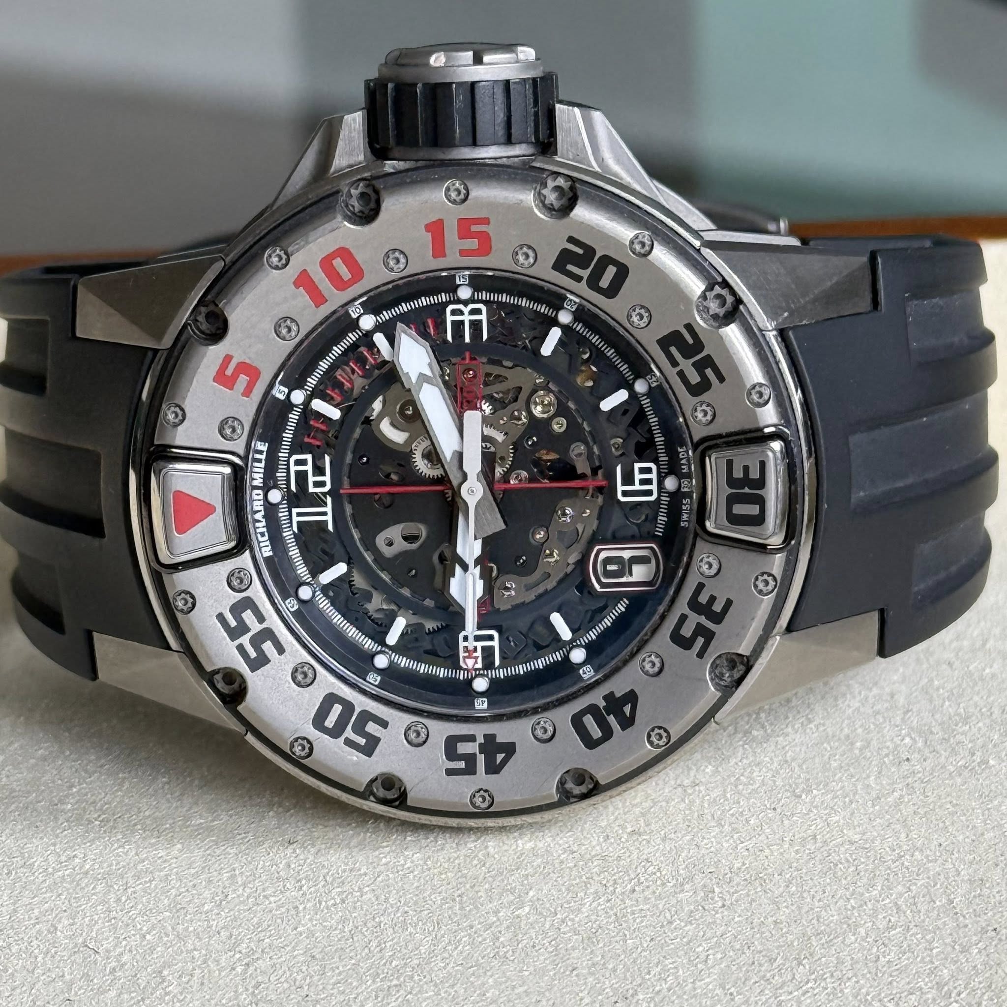 May be an image of wrist watch and text