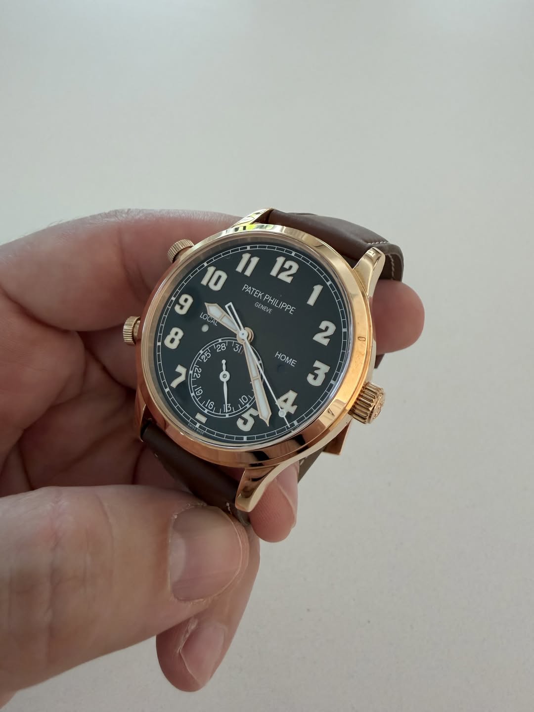 May be an image of wrist watch and text