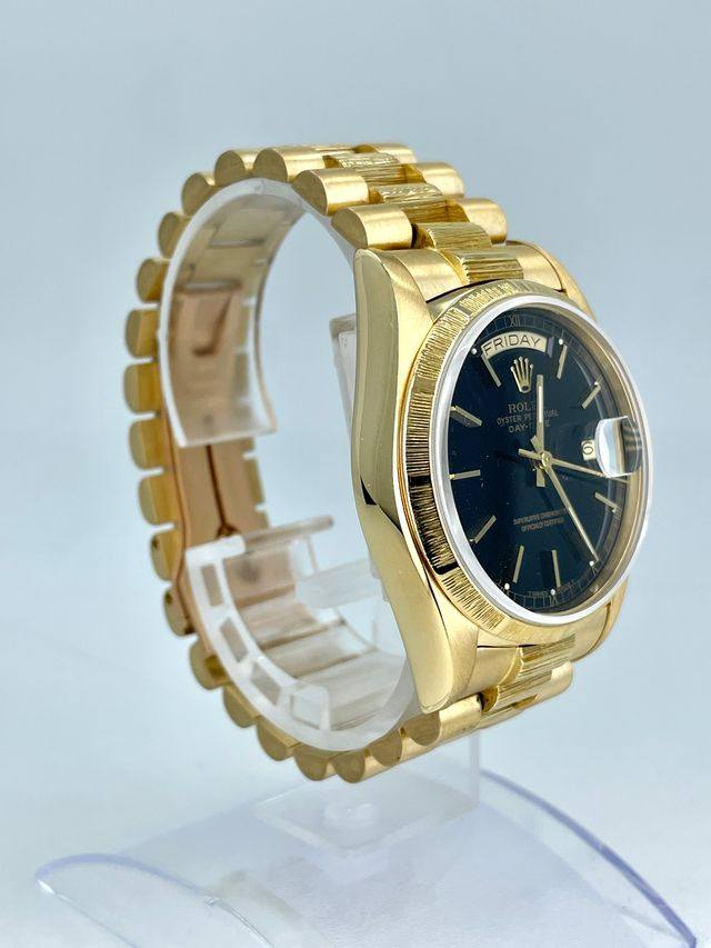 May be an image of digital watch, jewelry and text
