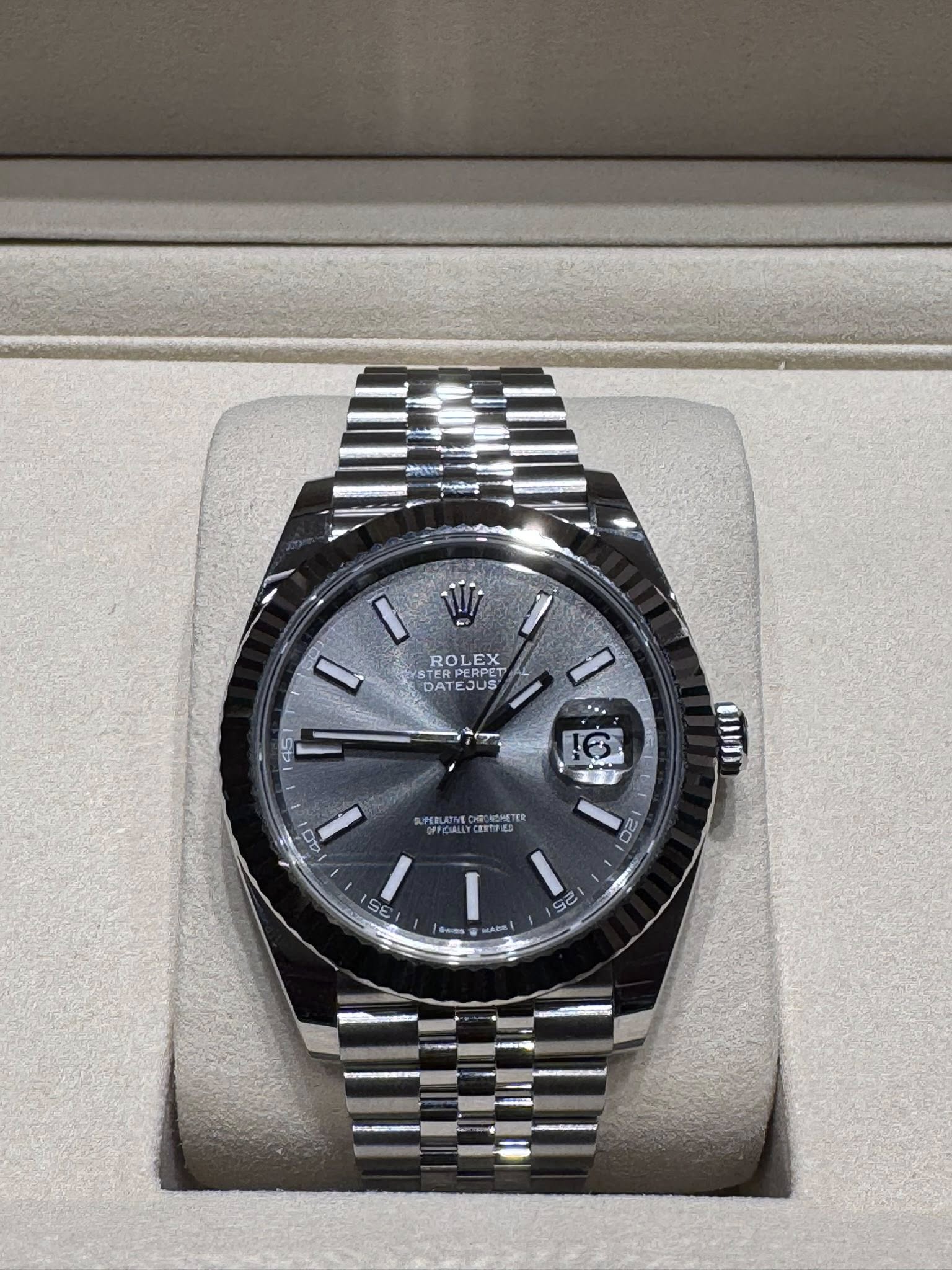 May be an image of wrist watch and text