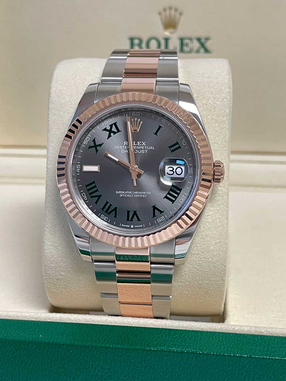 May be an image of wrist watch and text that says 'ROT ROLEX EX XI E5 55 R OYSTE DA 50 LEX ERPETUAL UAL JUST SUPERLATIVE PERLATIVECHREACHETER HRONGMETER OFFICIALL…