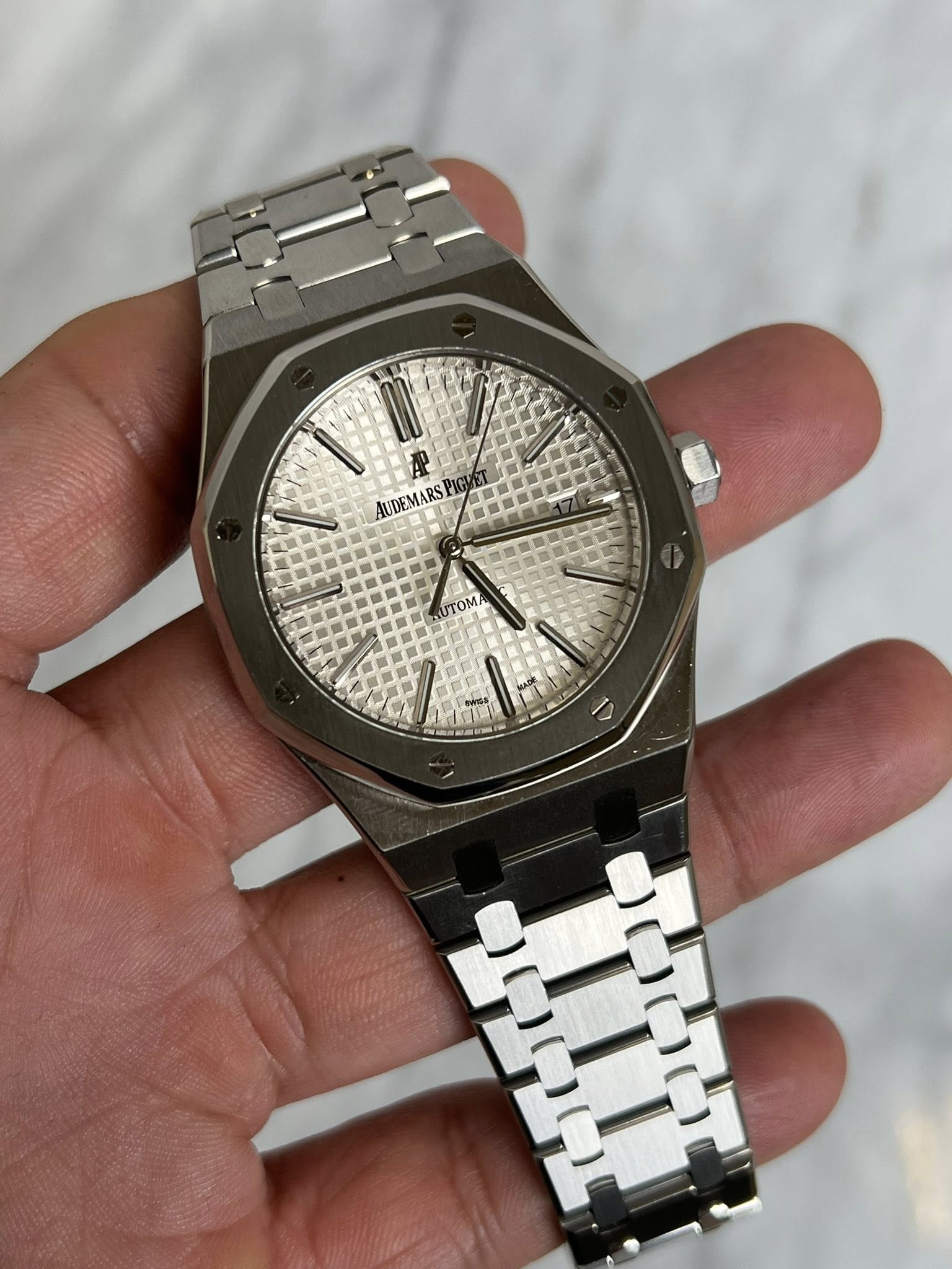 May be an image of wrist watch and text