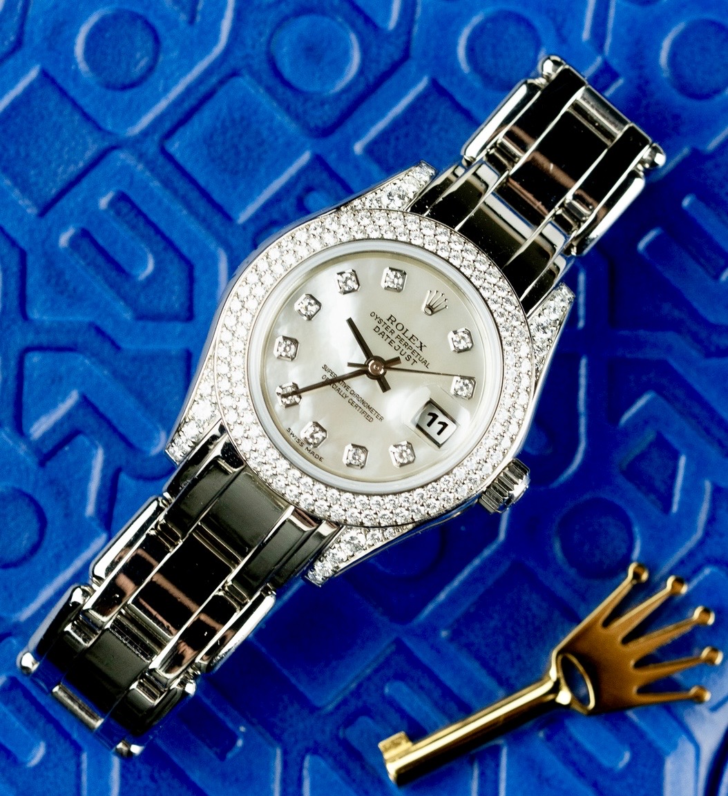 May be an image of wrist watch and text