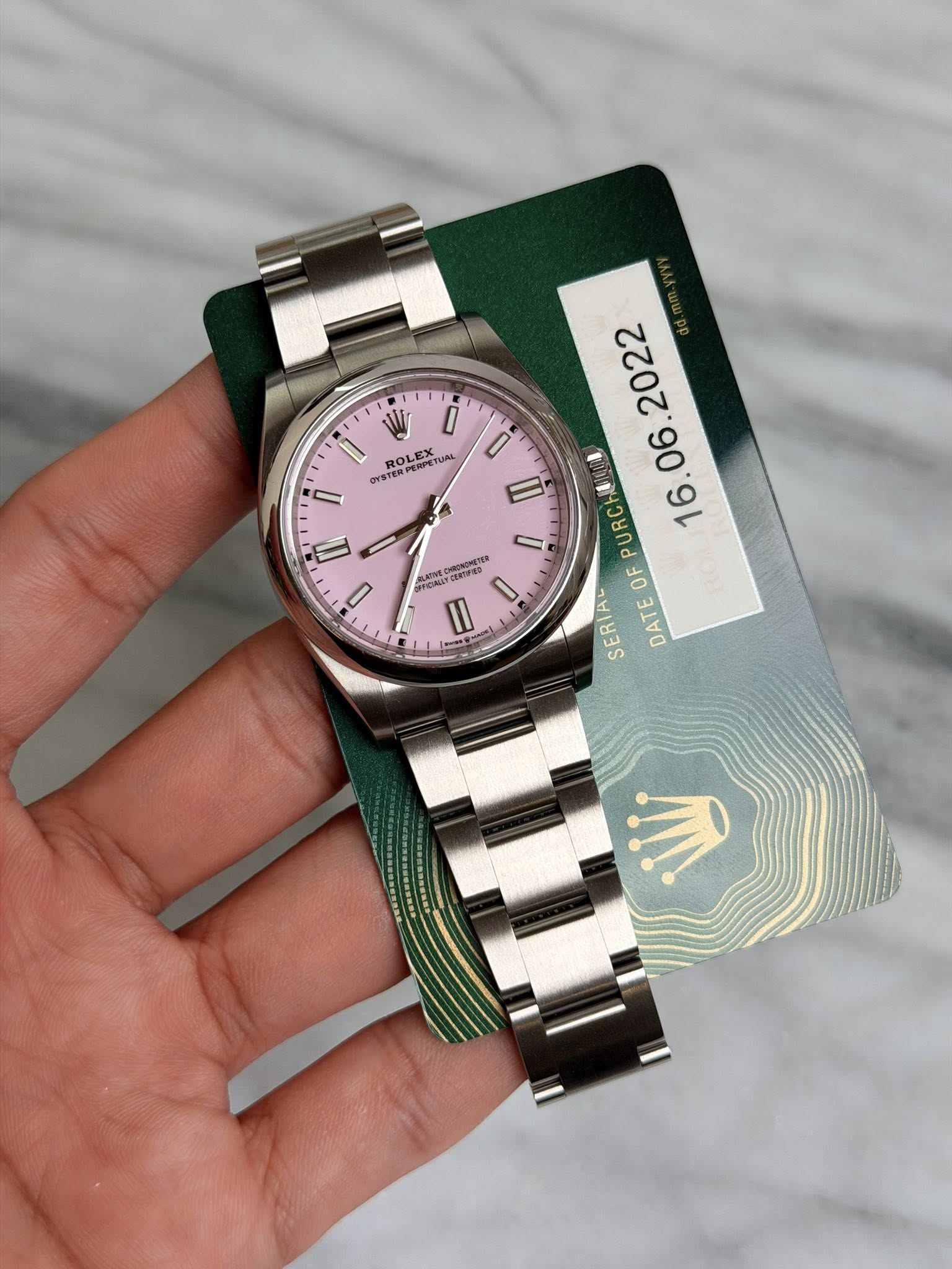 May be an image of wrist watch and text