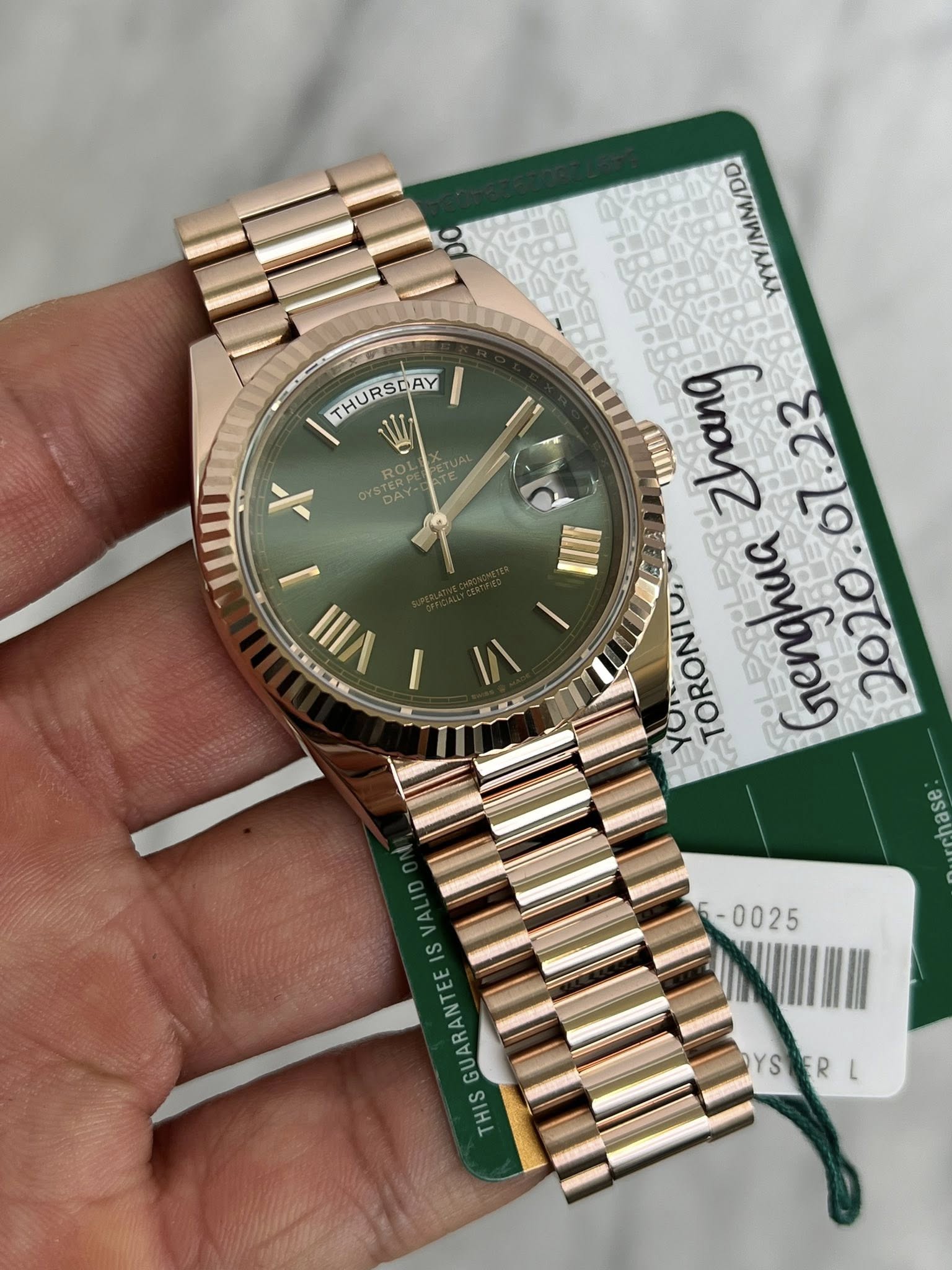 May be an image of wrist watch and text that says 'THURSDAY THURSDAY SACRP M ROL X I VIII 04980ン ពីព Zhang TORONI, Genghua GUARANTE GUAR HIS YSBERL YS'