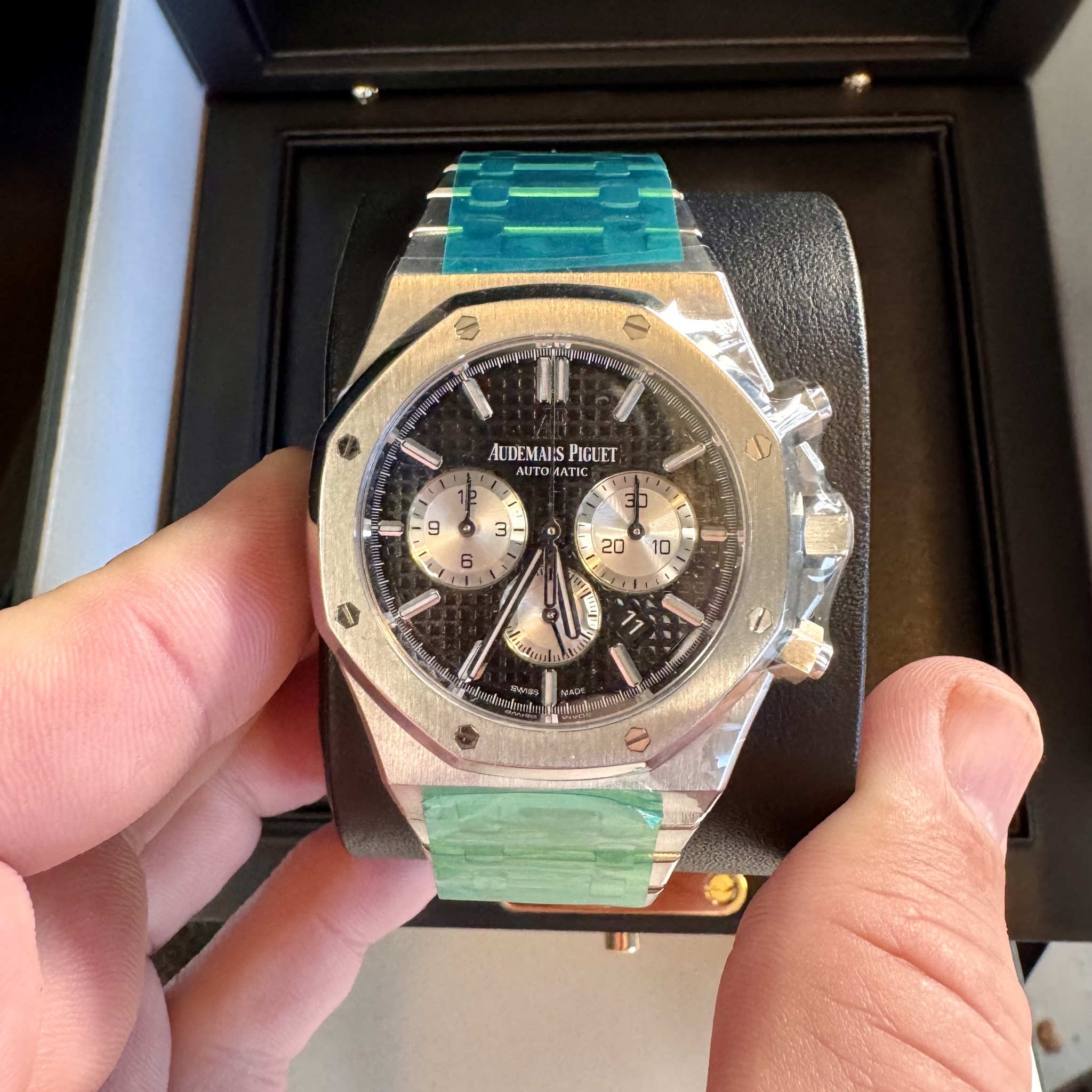 May be an image of wrist watch and text