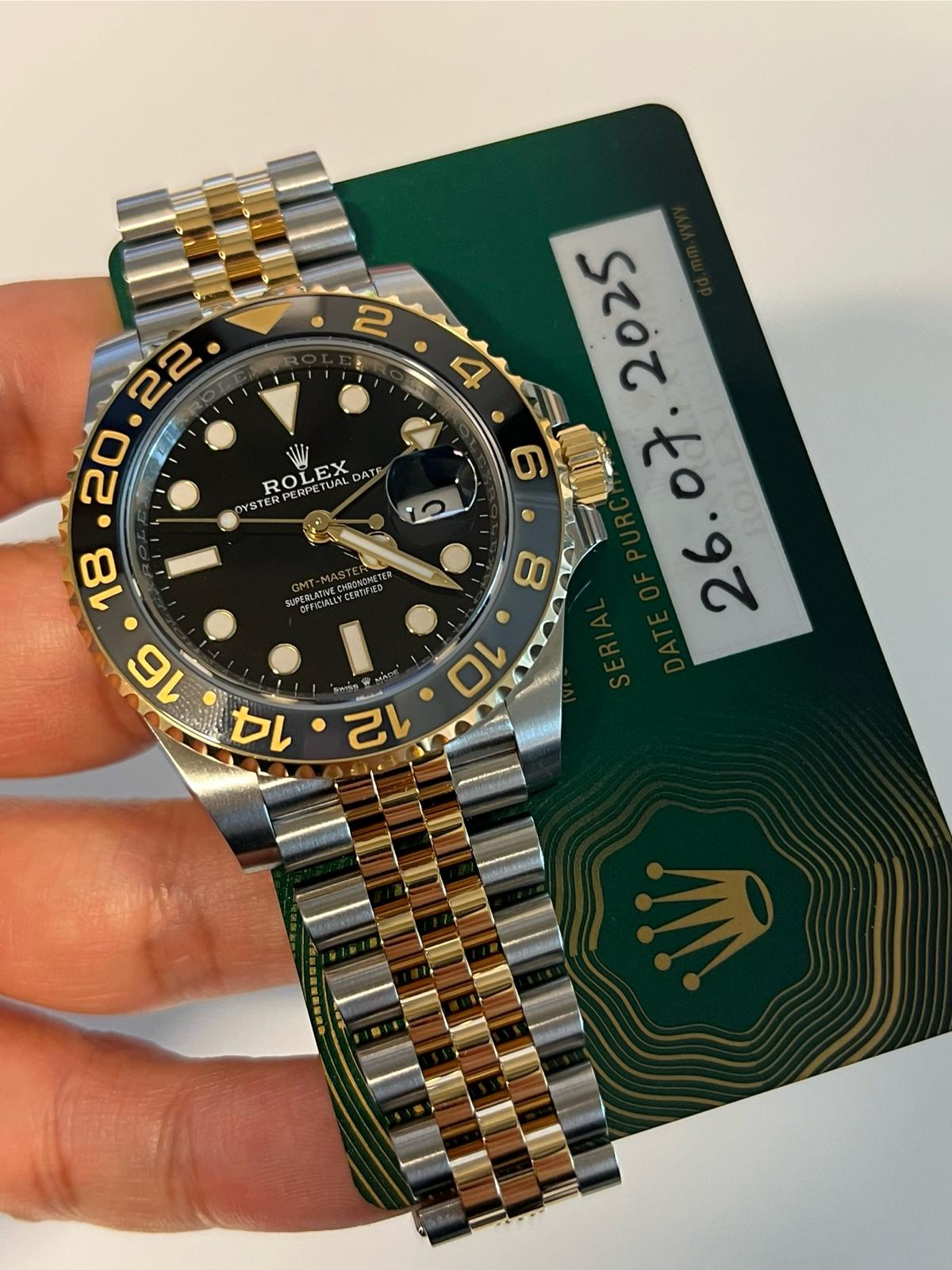 May be an image of wrist watch and text