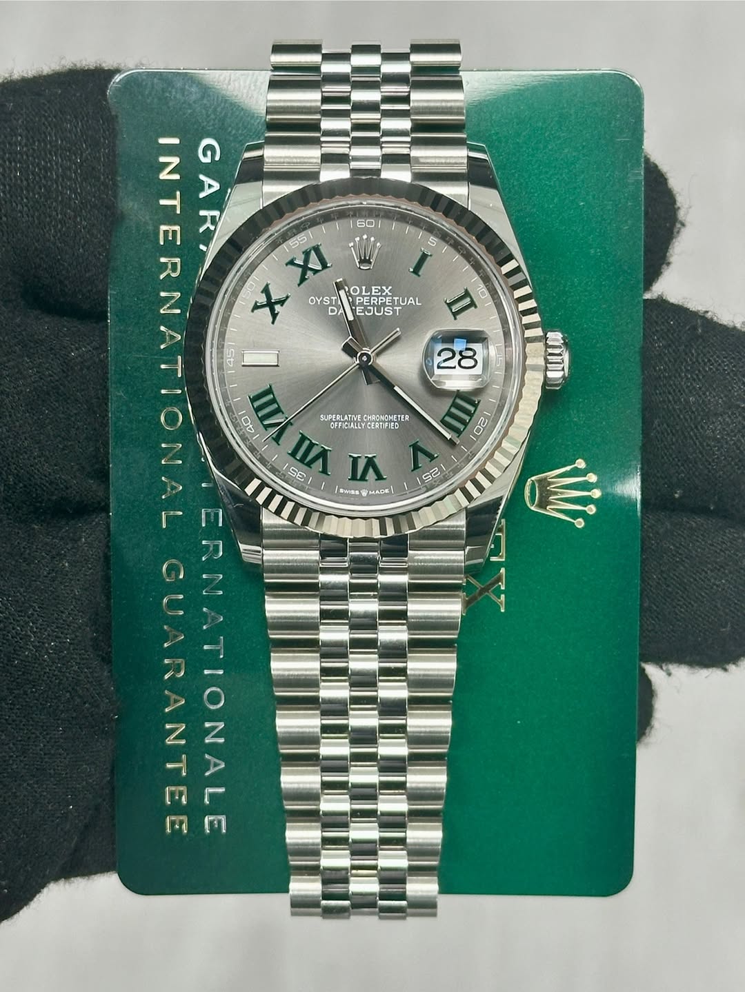 May be an image of wrist watch and text
