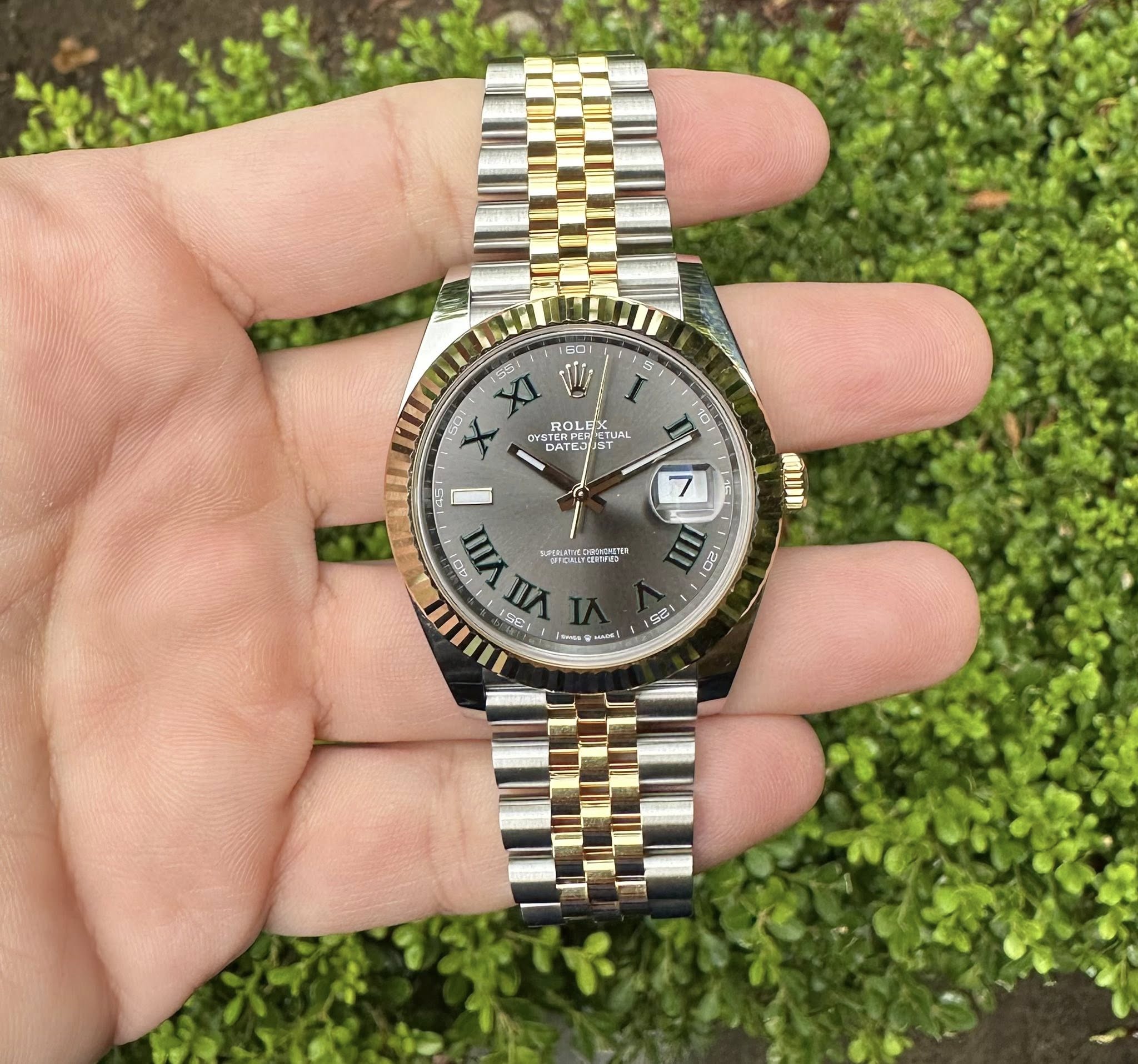 May be an image of wrist watch and text