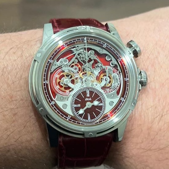 May be an image of wrist watch and text