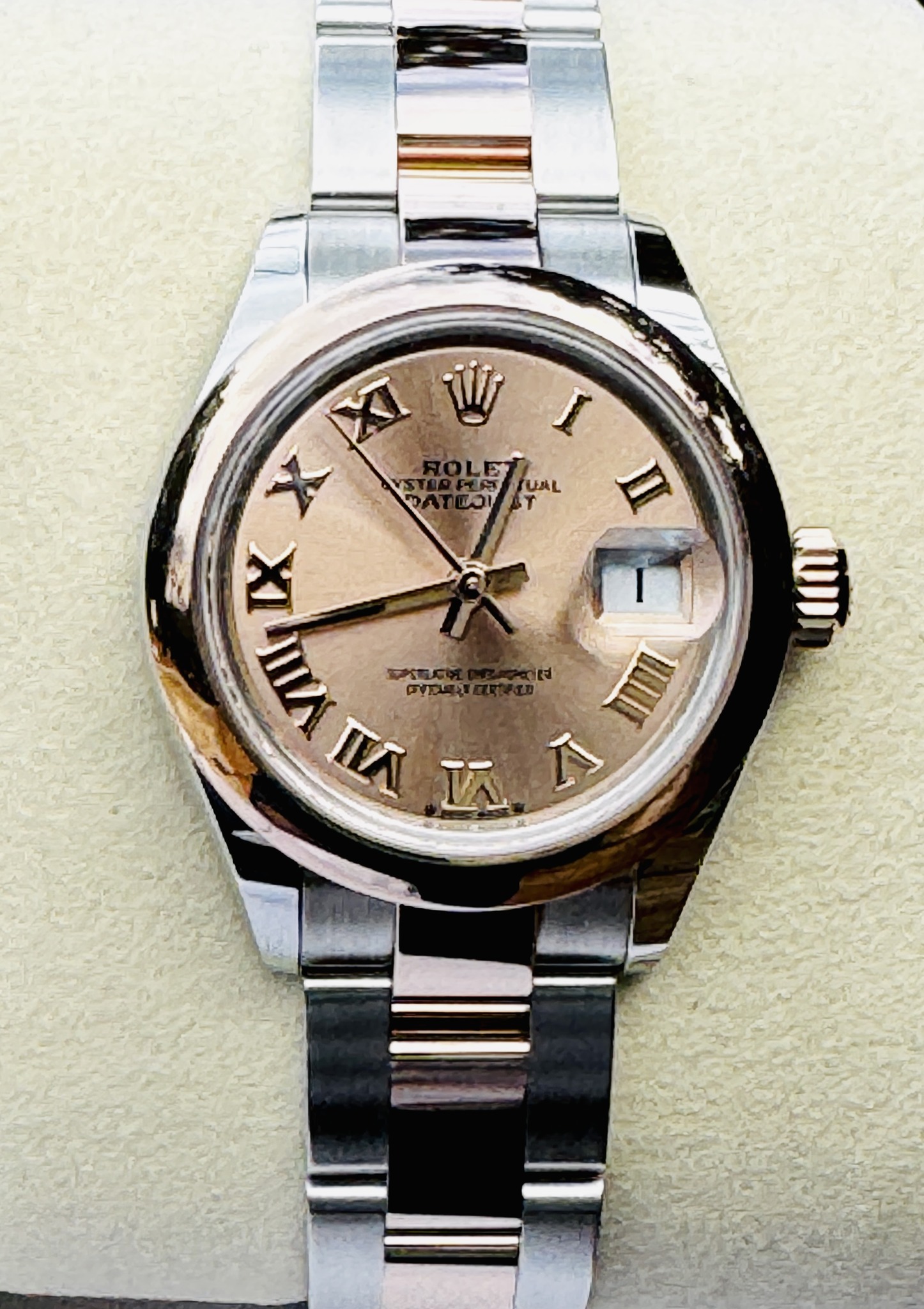 May be an image of wrist watch and text