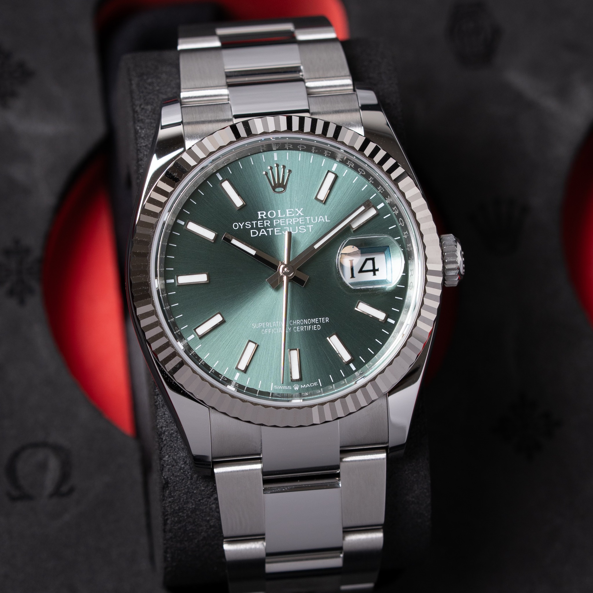 May be an image of wrist watch and text