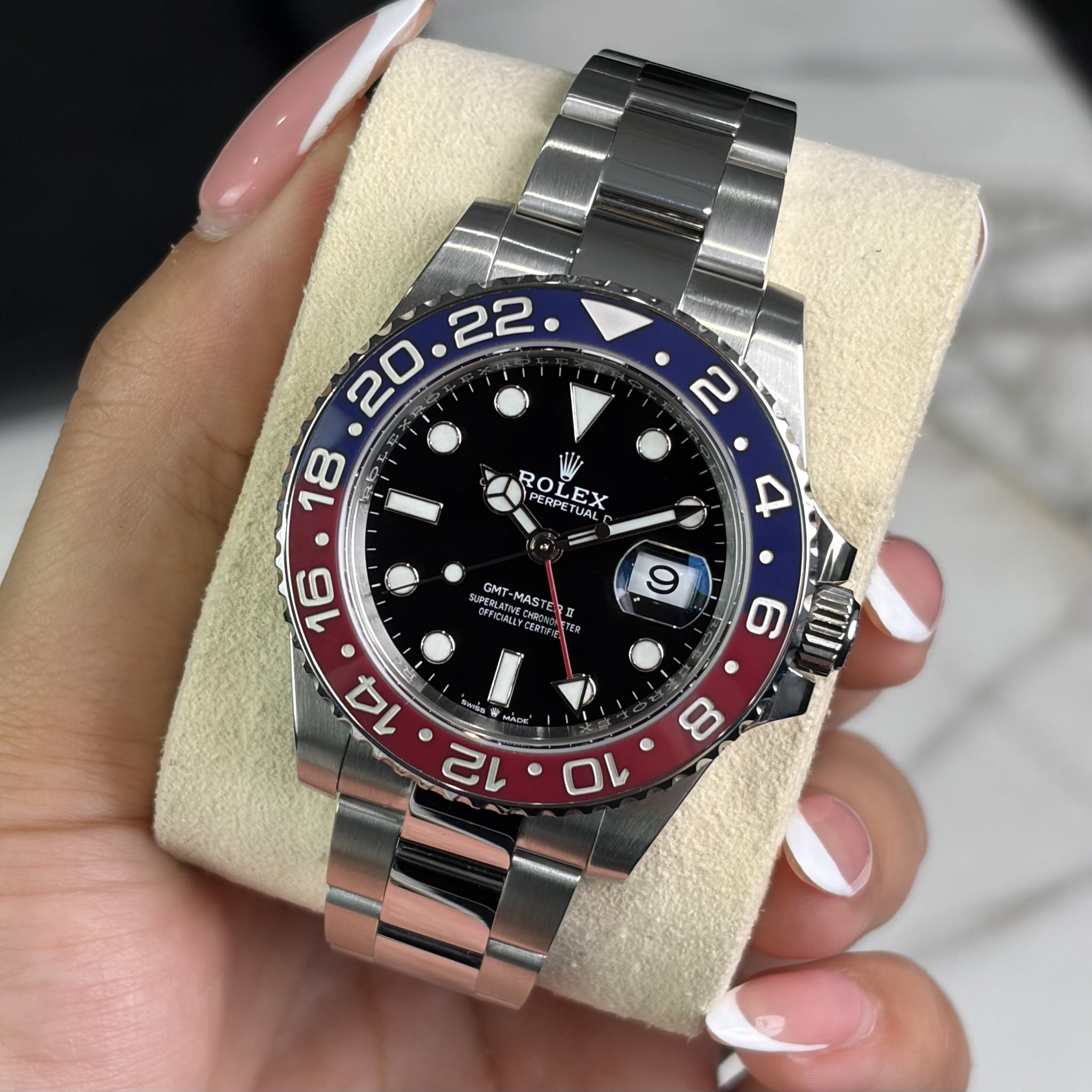 May be an image of wrist watch and text