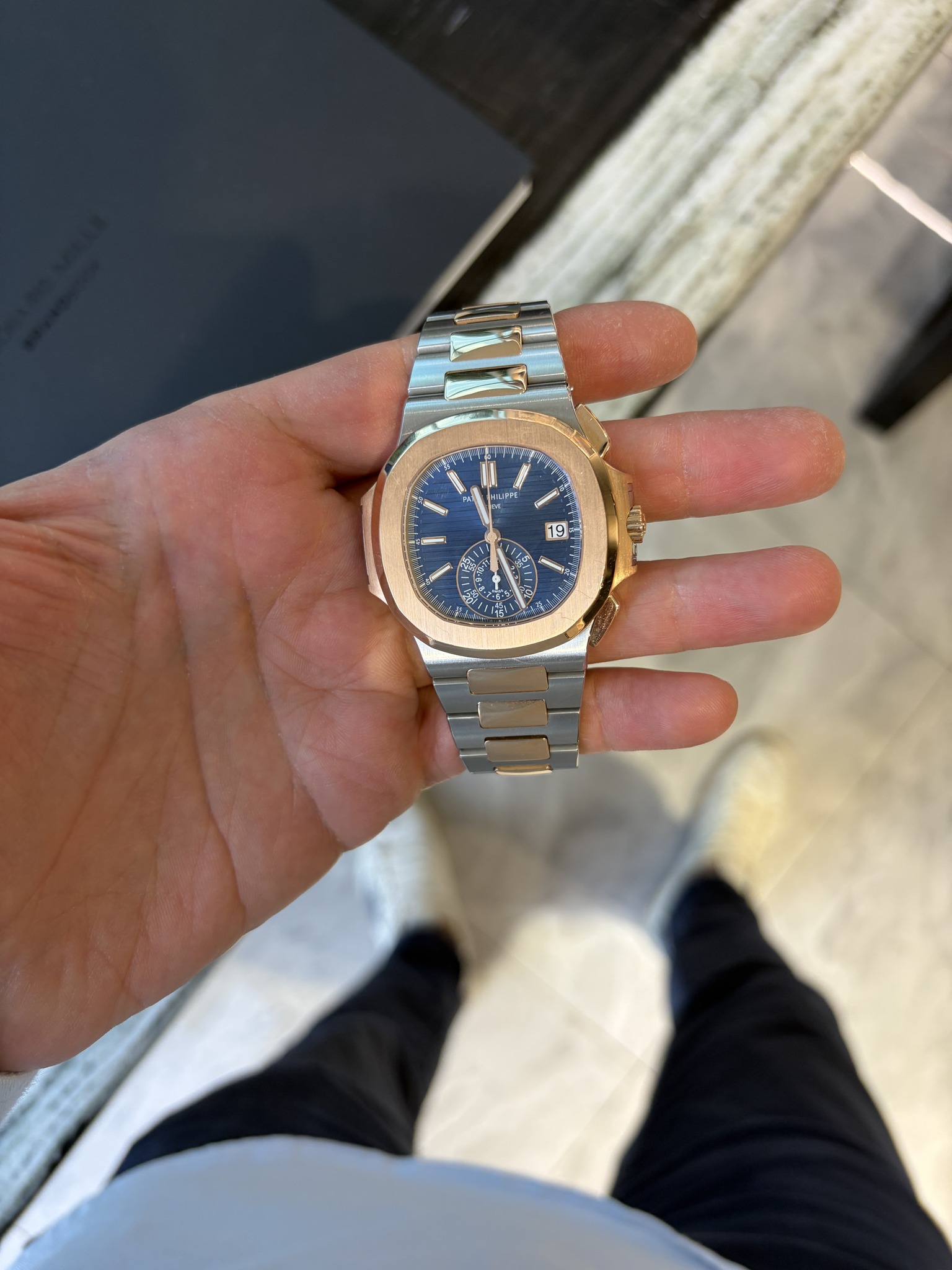 May be an image of wrist watch and text