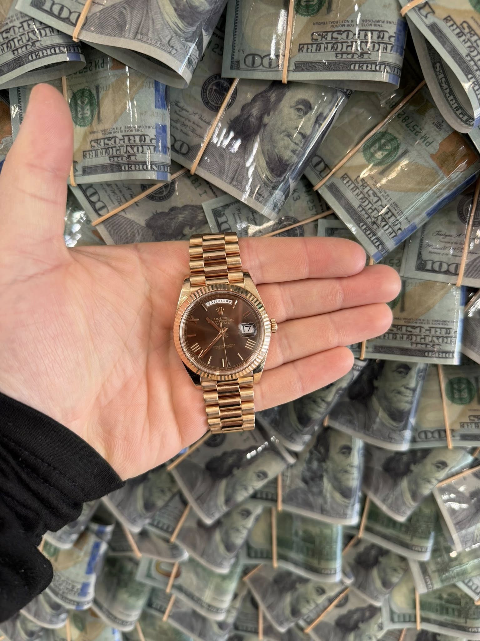 May be an image of wrist watch, money and text