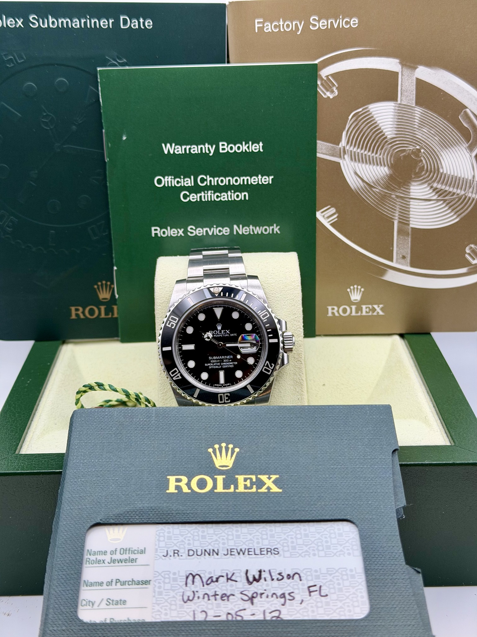 May be an image of wrist watch and text that says 'lex Submariner Date Factory FactoryService Service Warranty Booklet Official Chronometer Certification Rolex Service Network ROLI…