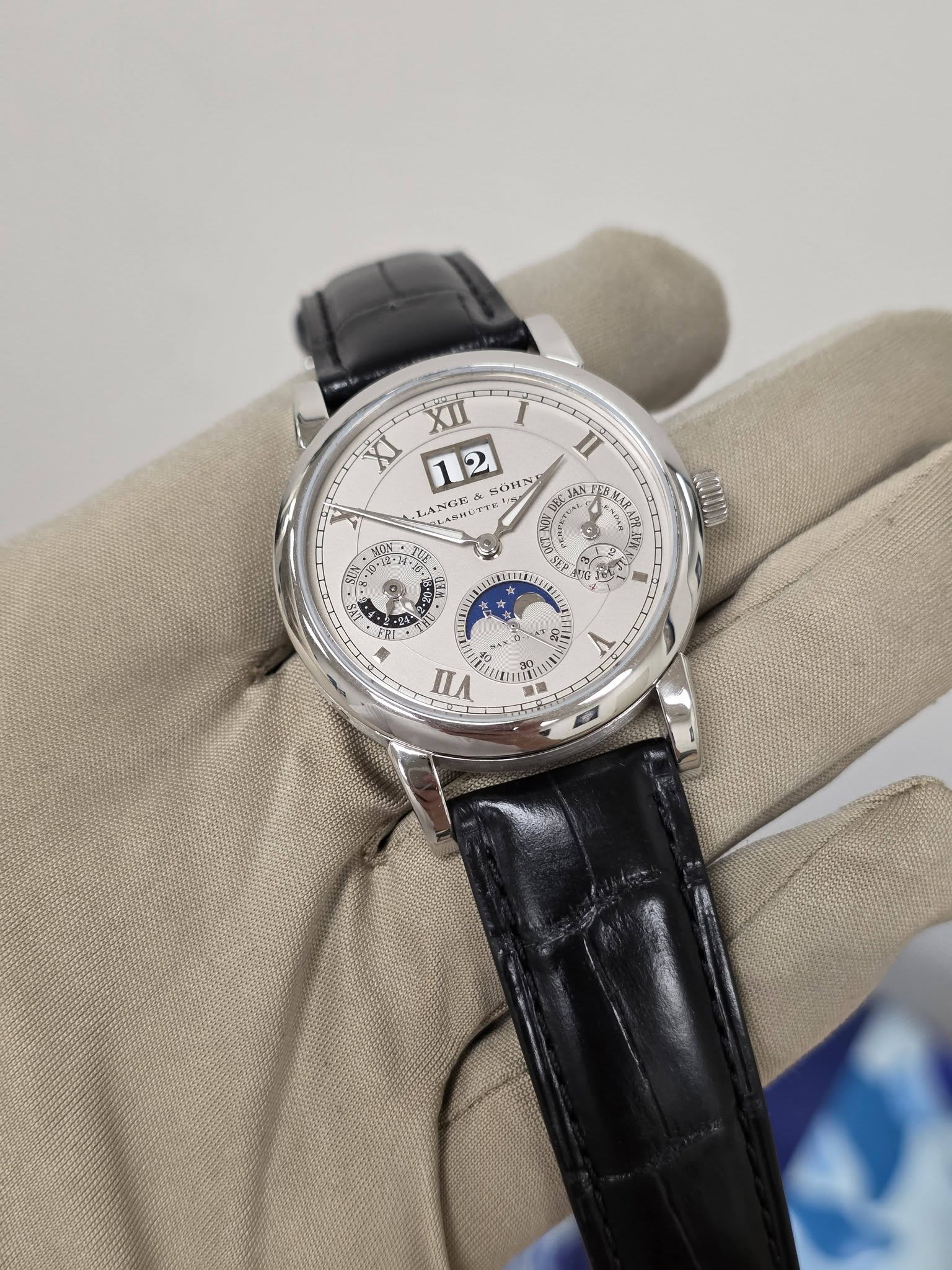 May be an image of wrist watch and text