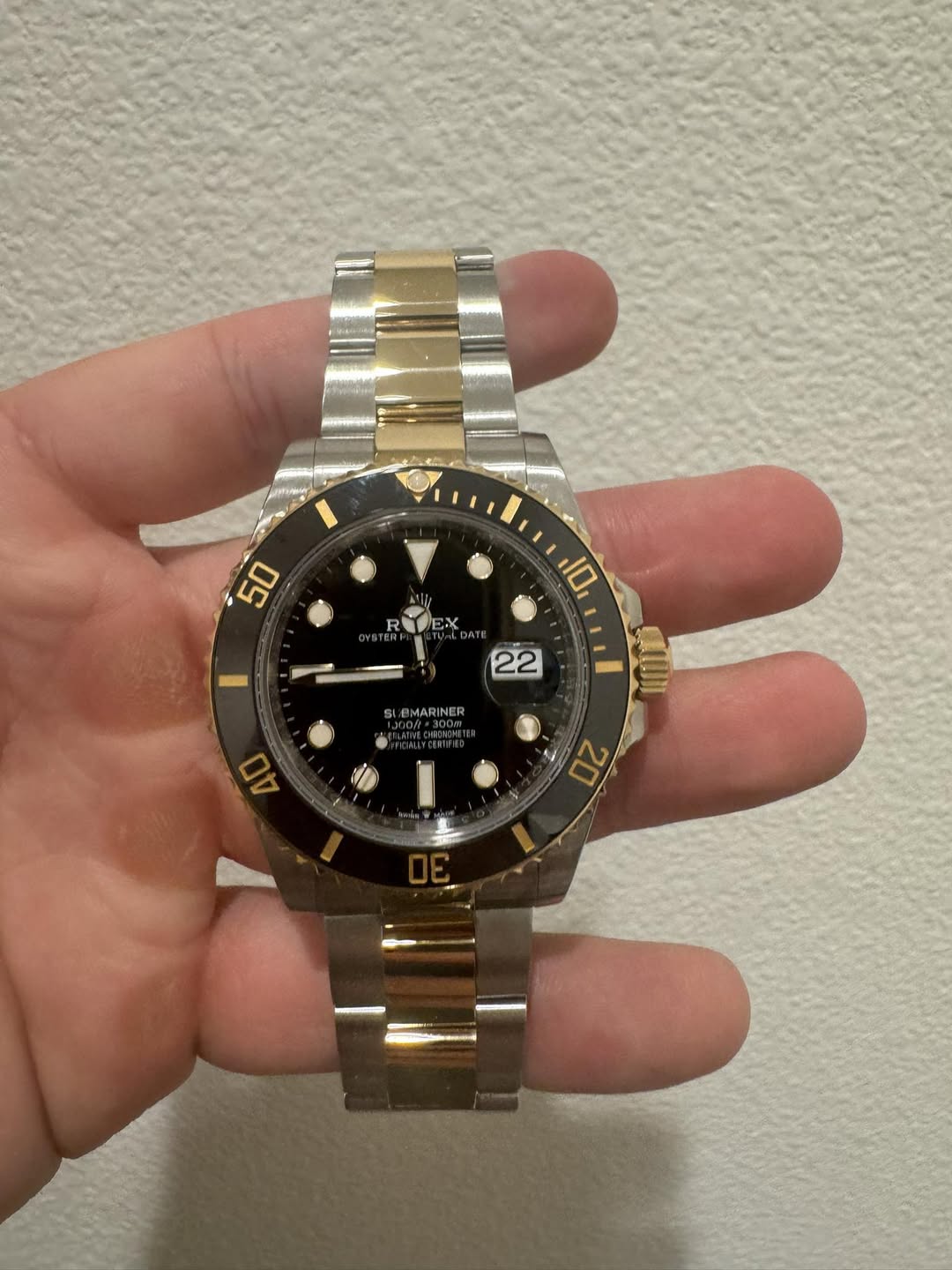 May be an image of wrist watch and text