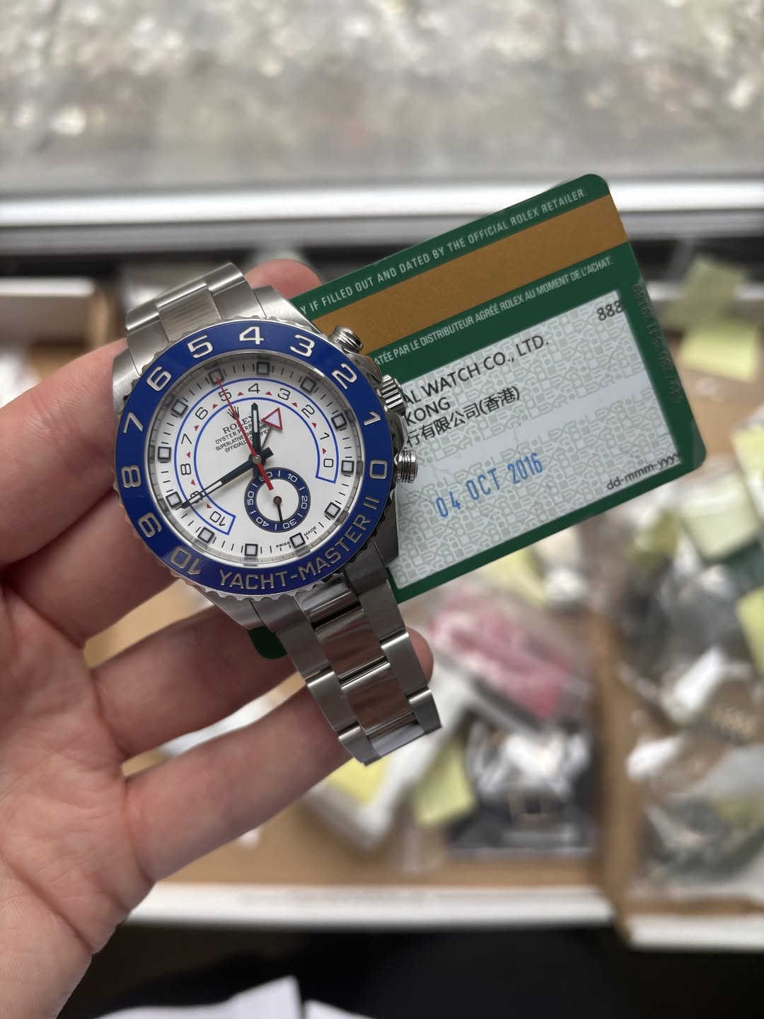 May be an image of wrist watch and text that says 'ROLEX ROLEXRETAILEA. RETAILER. THE OFFICIAL AND DATED 'ACHAT IF FILLED OUT GREE ROLEX XAUMOMENT TEUR 3 3 2 IWATCH.CO.LTD. LTD.…