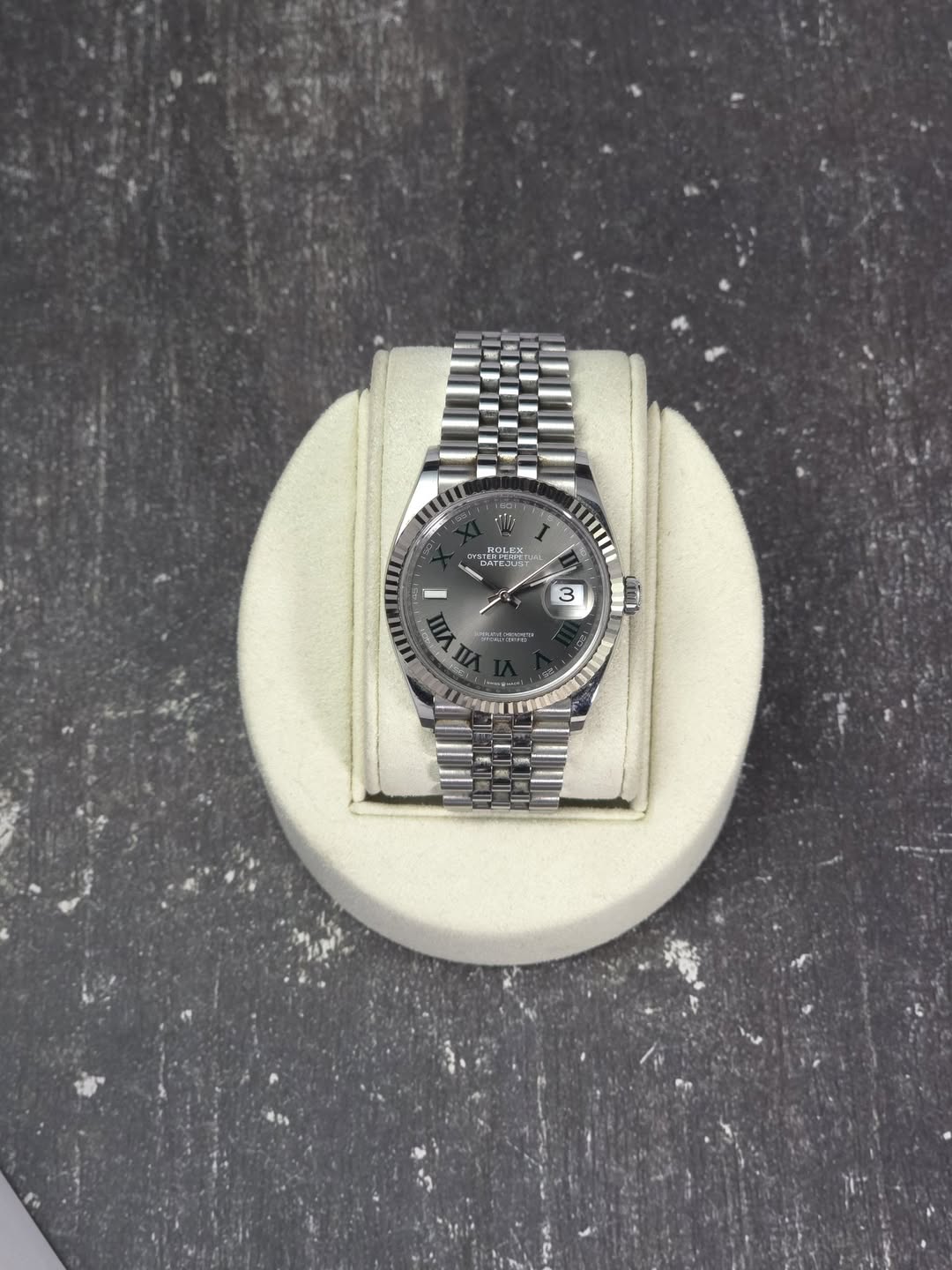 May be an image of wrist watch and text