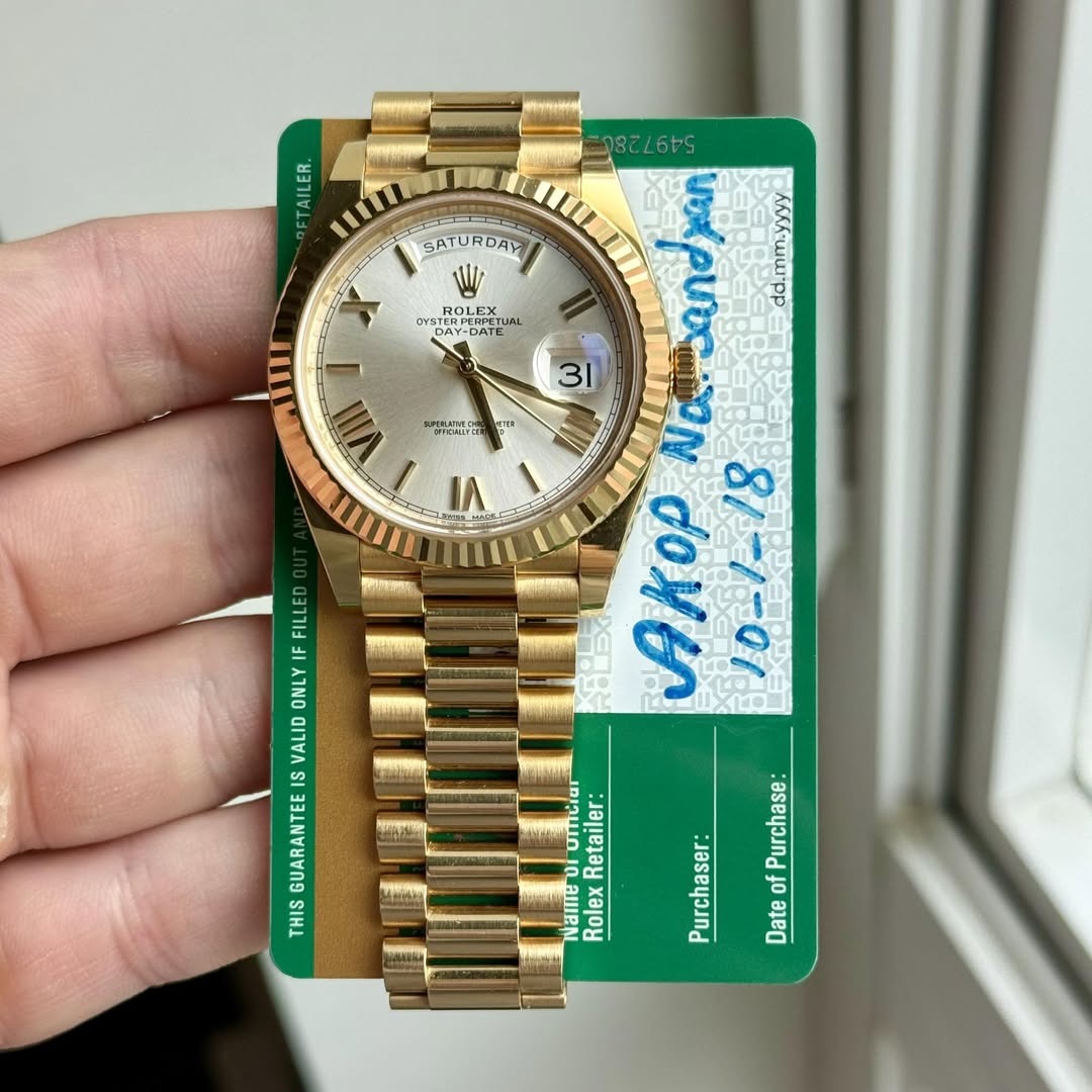 May be an image of wrist watch, money and text