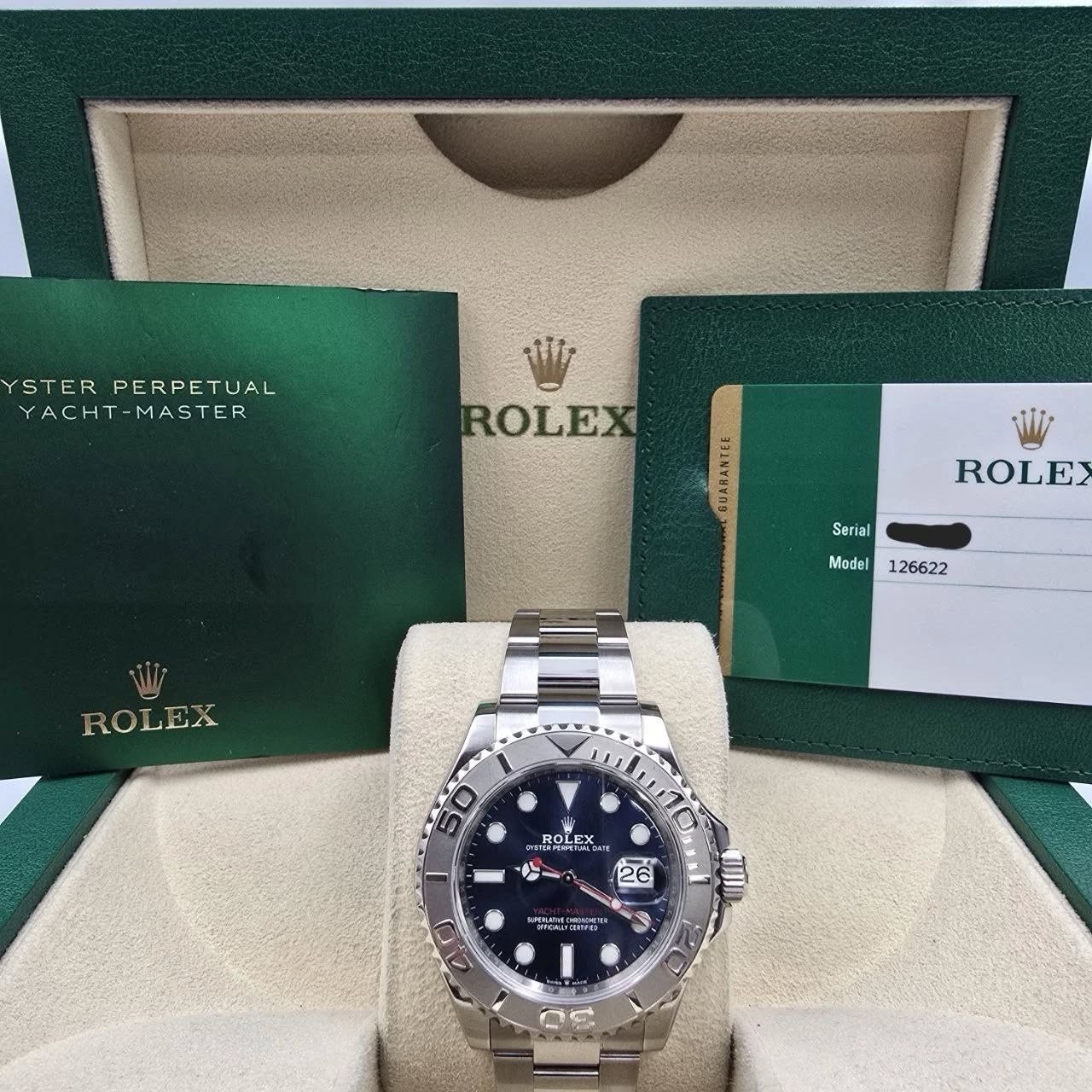 May be an image of wrist watch and text that says 'YSTER STERPERPETUAL PERPETUAL YACHT-MASTER YACHT -MASTER Wi ROLEX ROLE Serial Ser Model 126622 ROLEX 50 PRIT ROR品 BOLEX طه 26…