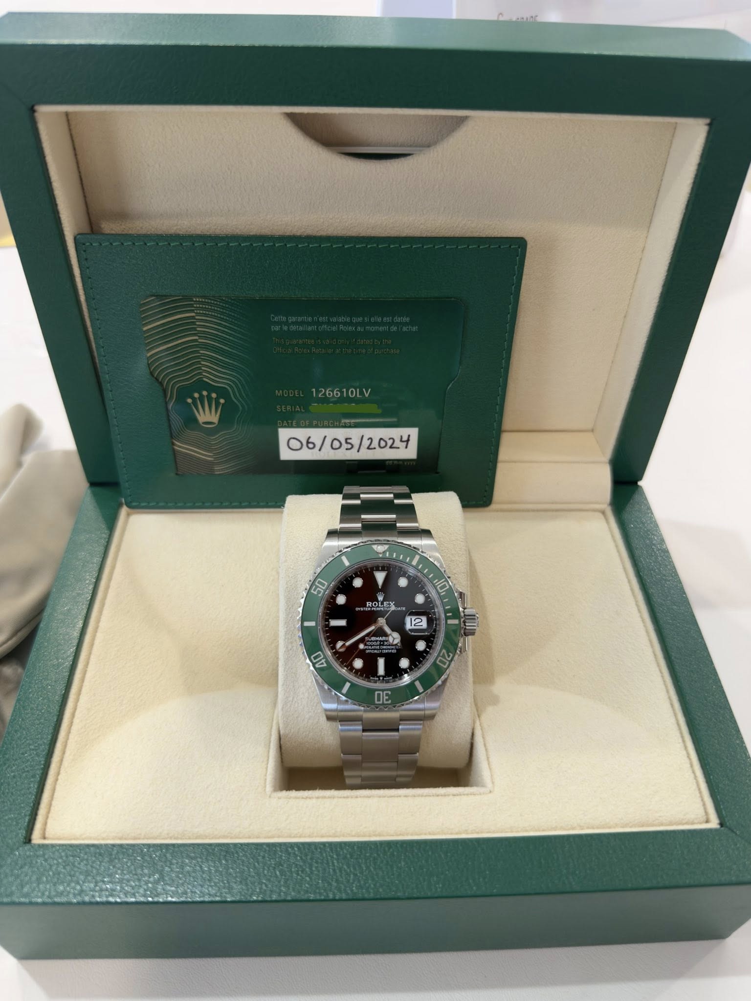 May be an image of wrist watch and text that says '126610LV 06/05/2024 50 ROLEX 10 12 40 OE E'