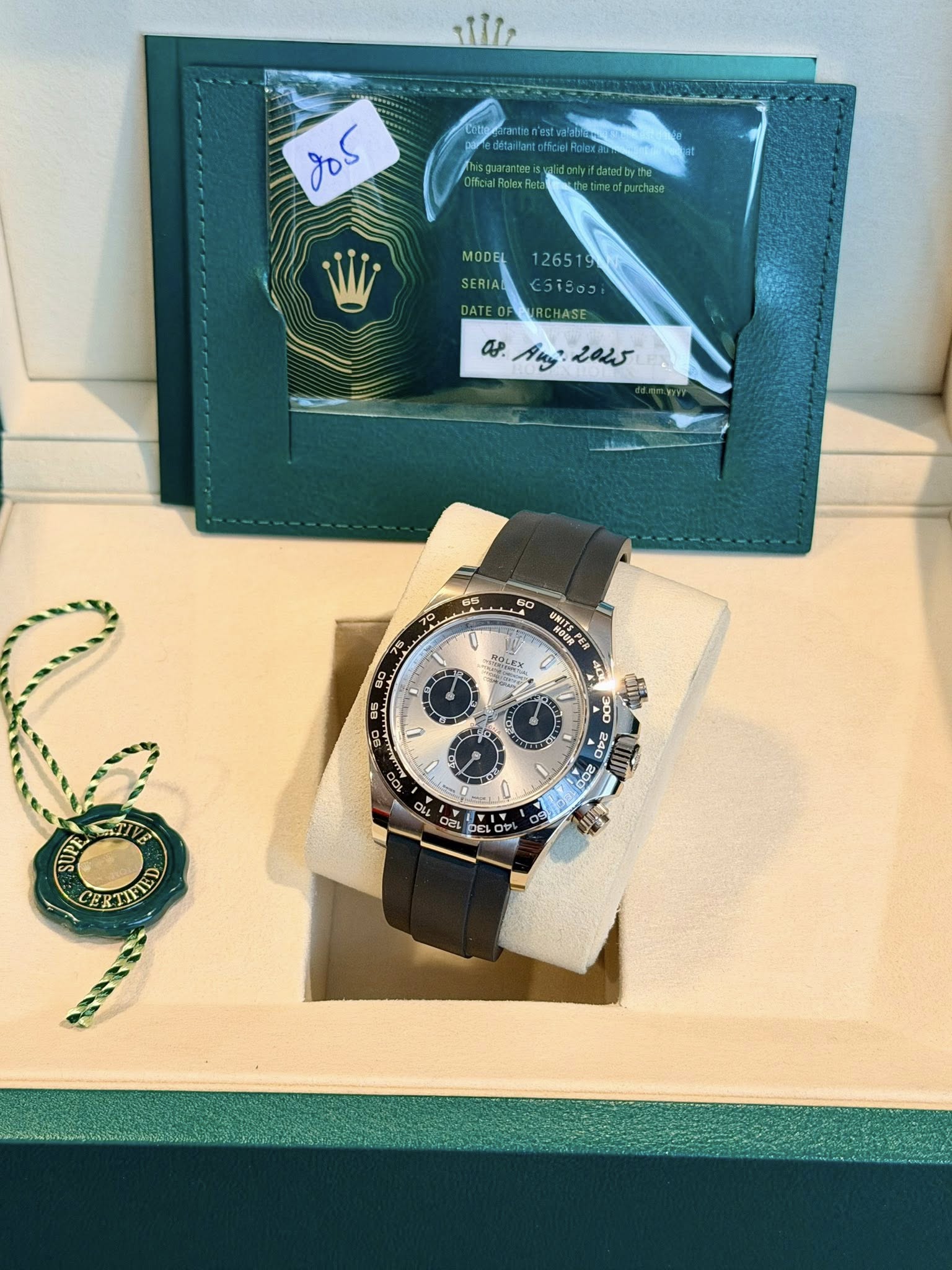 May be an image of wrist watch and text that says 'శಿం MODEL 126519 SERIA EST9o င5.၁ DATEOP as a.Anj2015 Ang eous U ROLEX RITEP n 90 黑 U O 4 SUPE CERTIFIED'