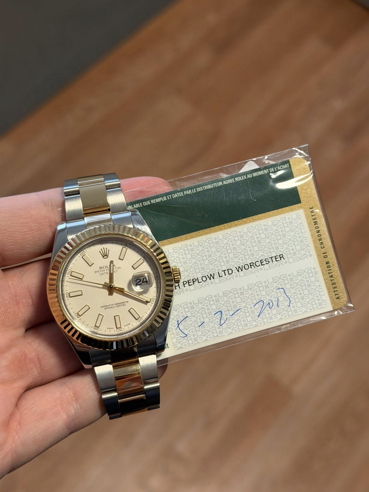 May be an image of wrist watch and text