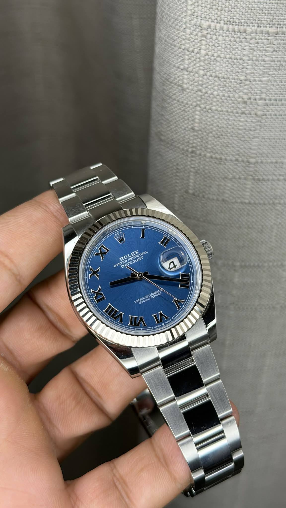 May be an image of wrist watch and text