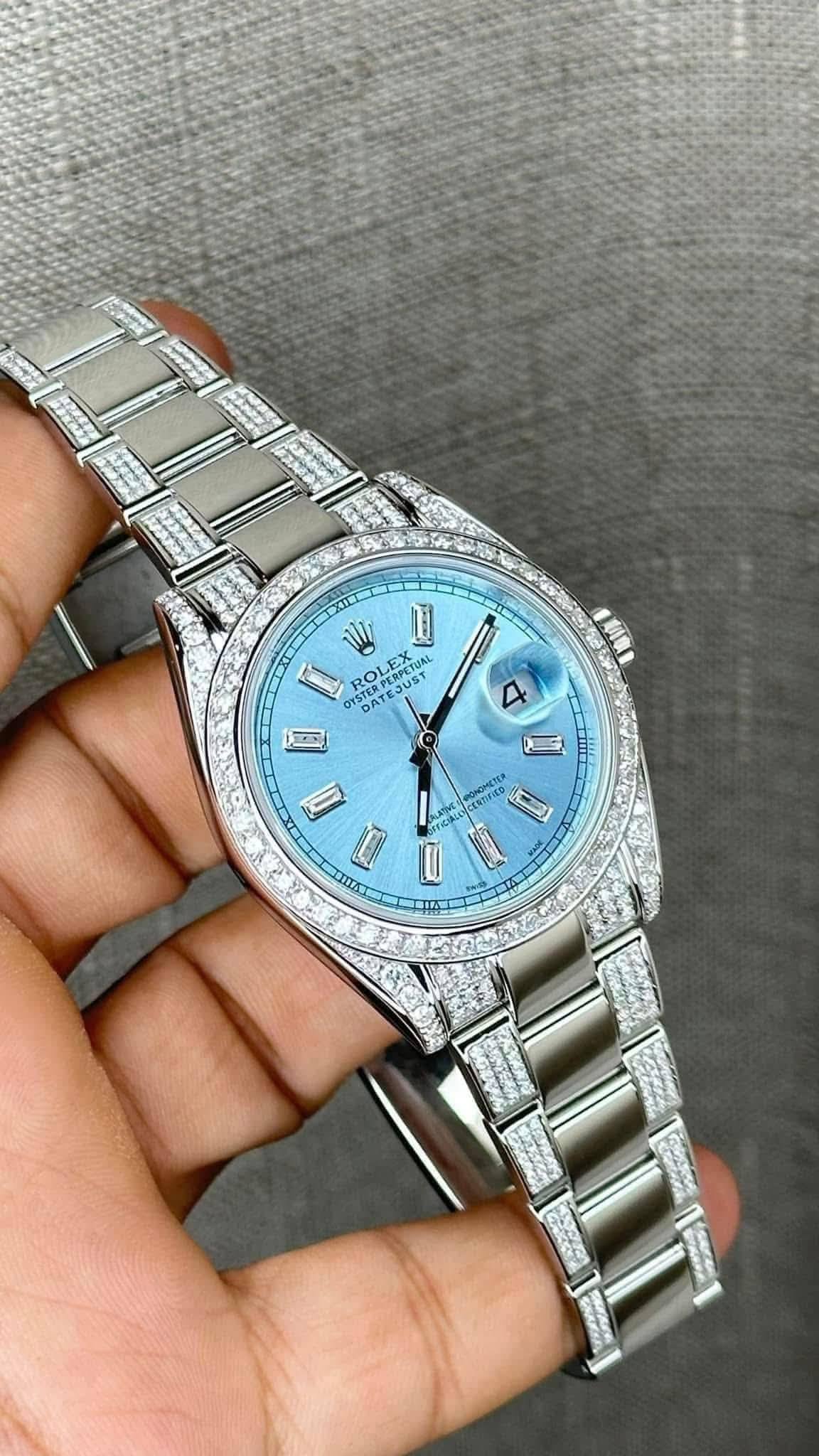 May be an image of wrist watch and text