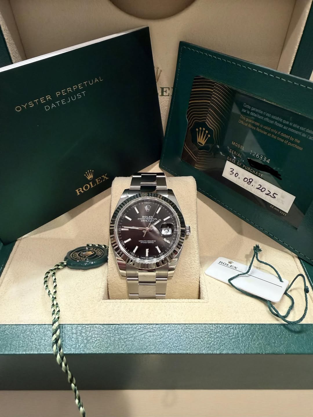 May be an image of wrist watch and text