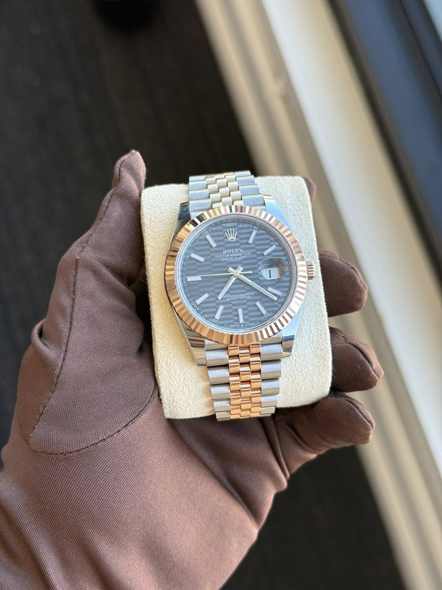 May be an image of wrist watch and text
