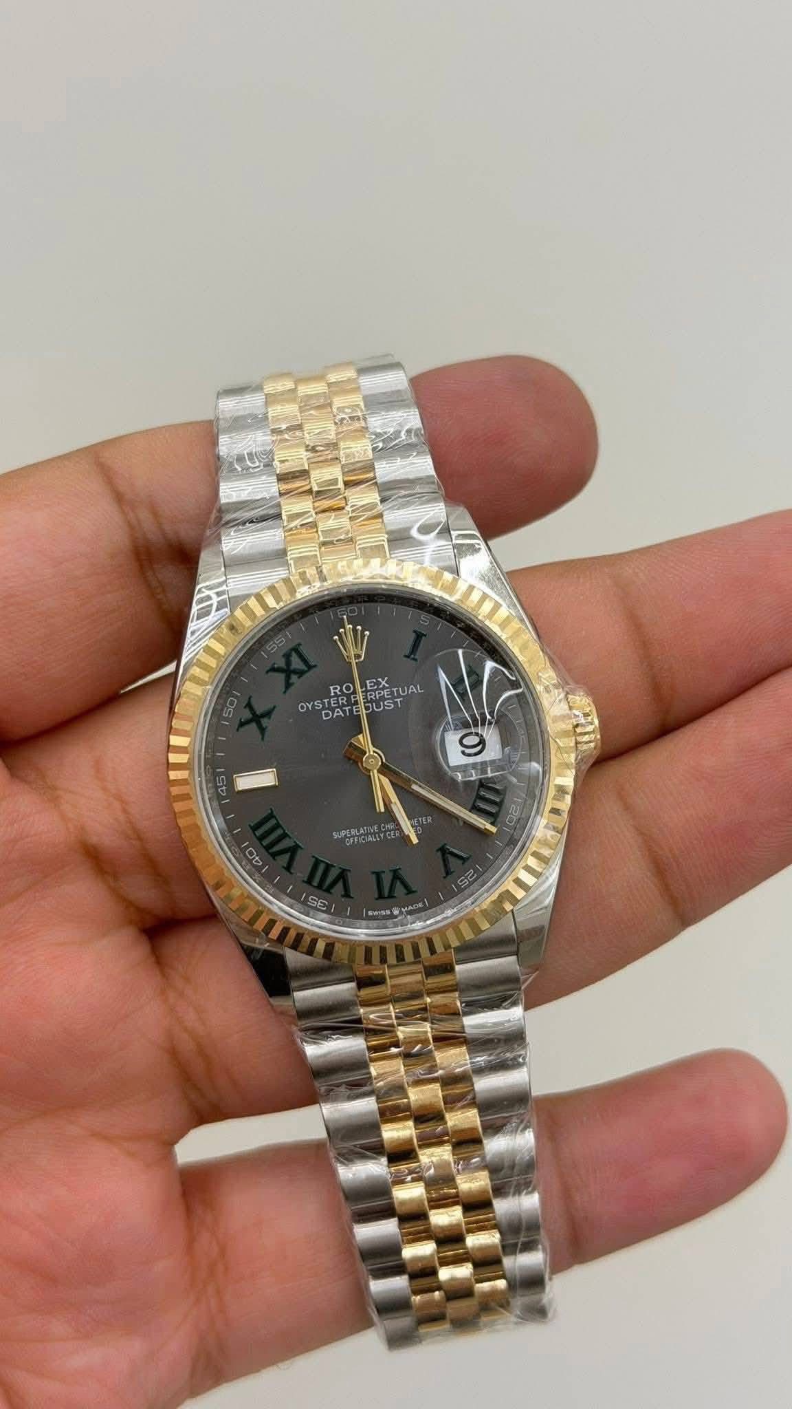 May be an image of wrist watch and text