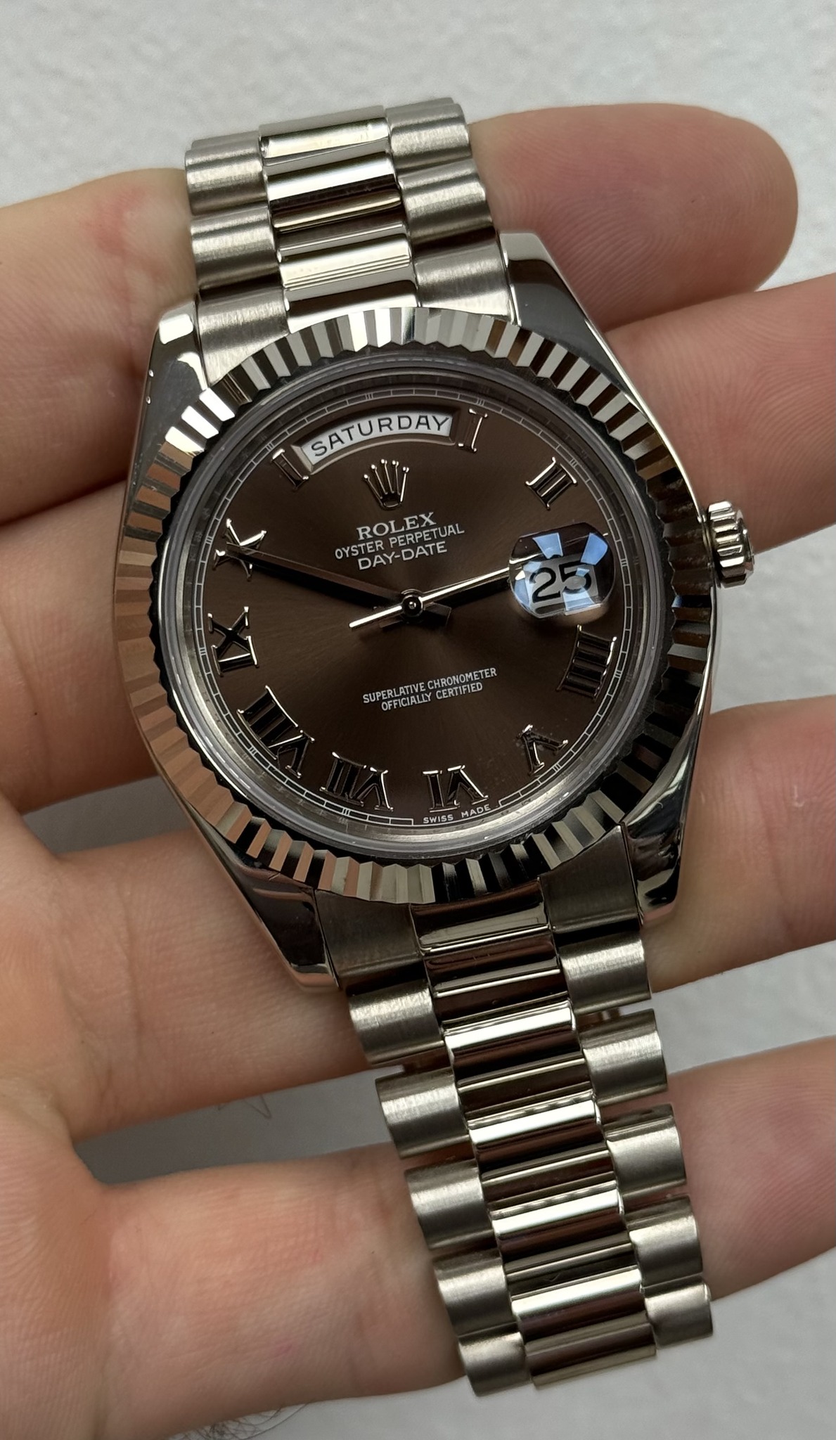 May be an image of wrist watch and text