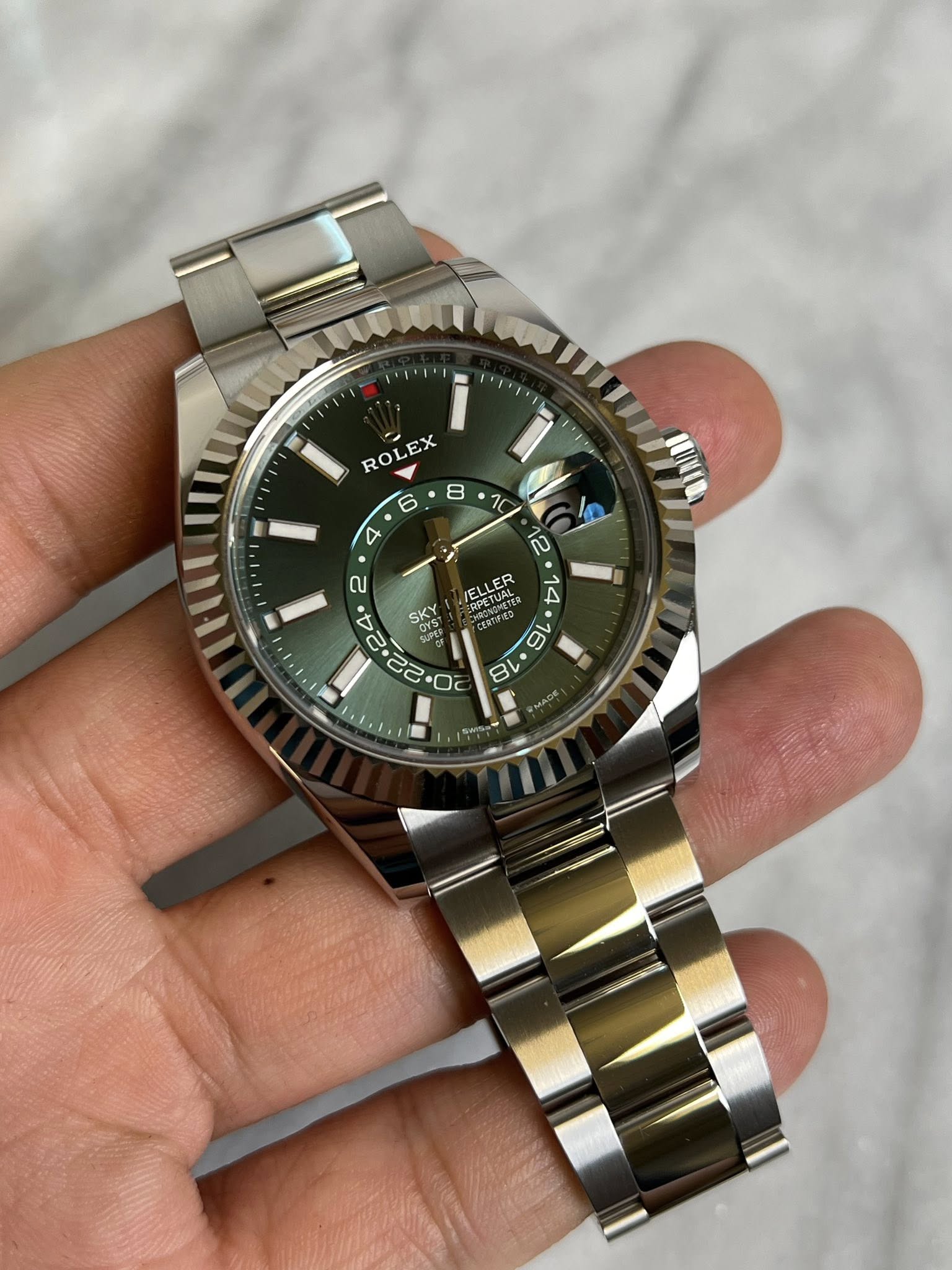 May be an image of wrist watch and text