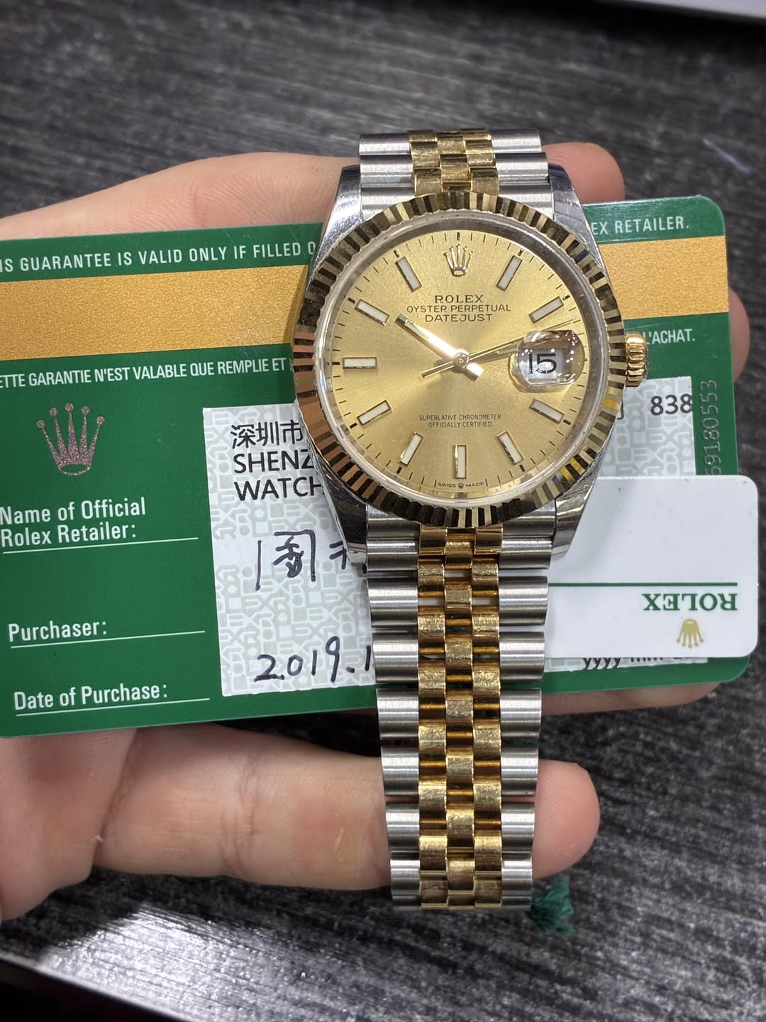 May be an image of wrist watch and text