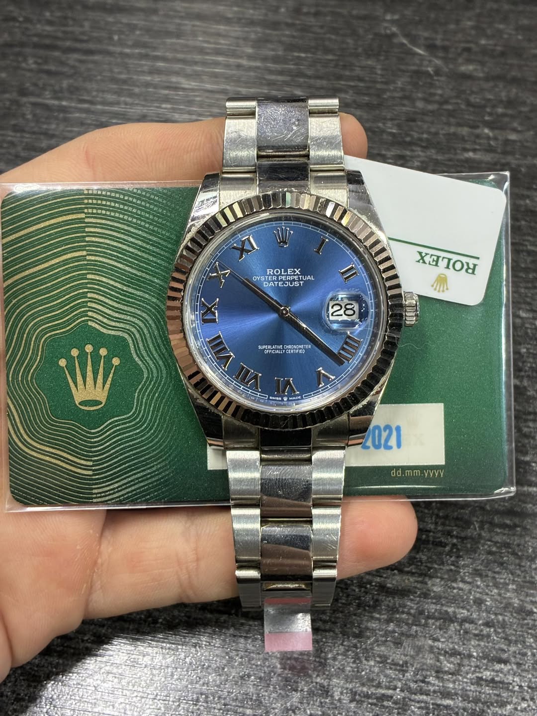 May be an image of wrist watch and text