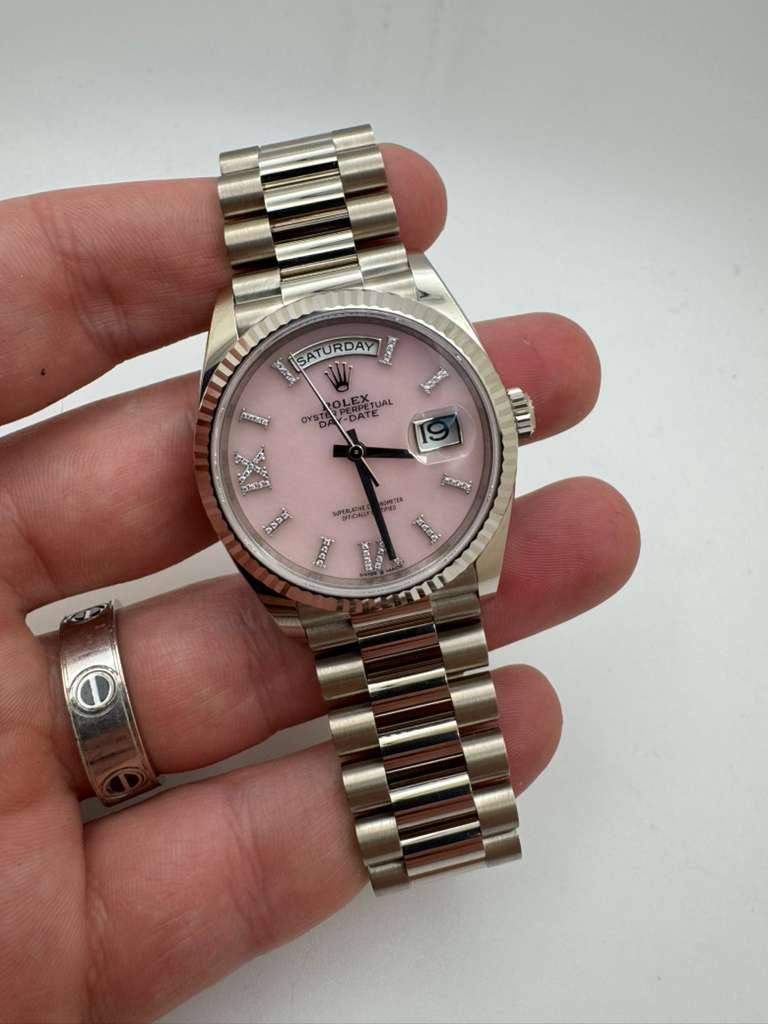 May be an image of wrist watch and text