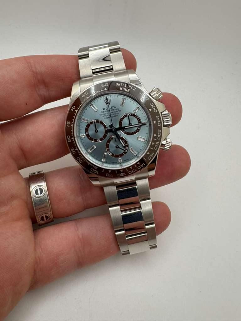 May be an image of wrist watch and text