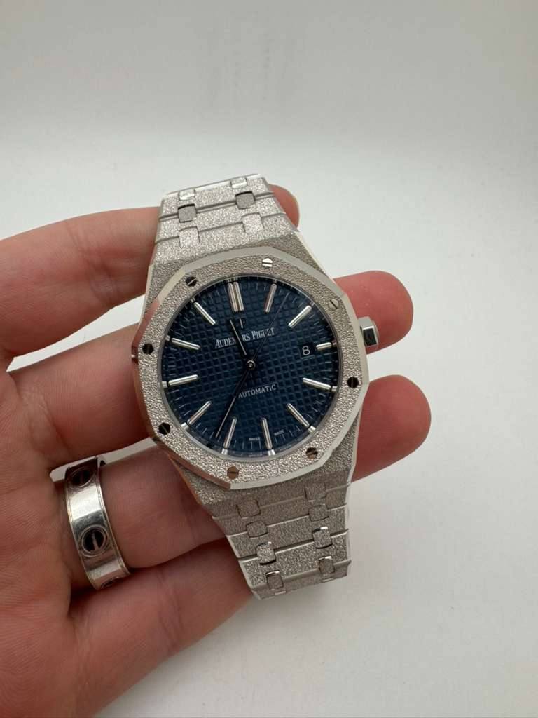 May be an image of wrist watch and text