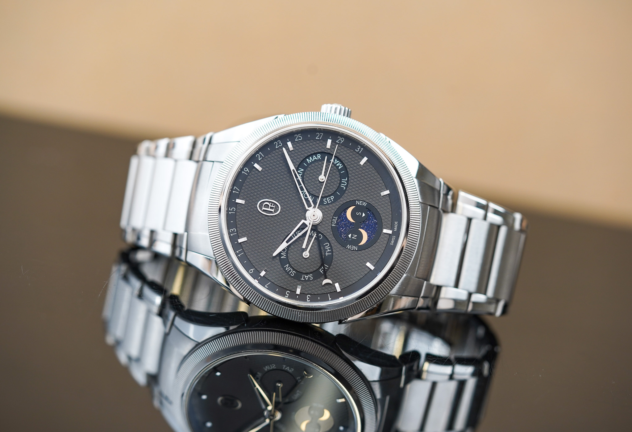 May be an image of wrist watch and text