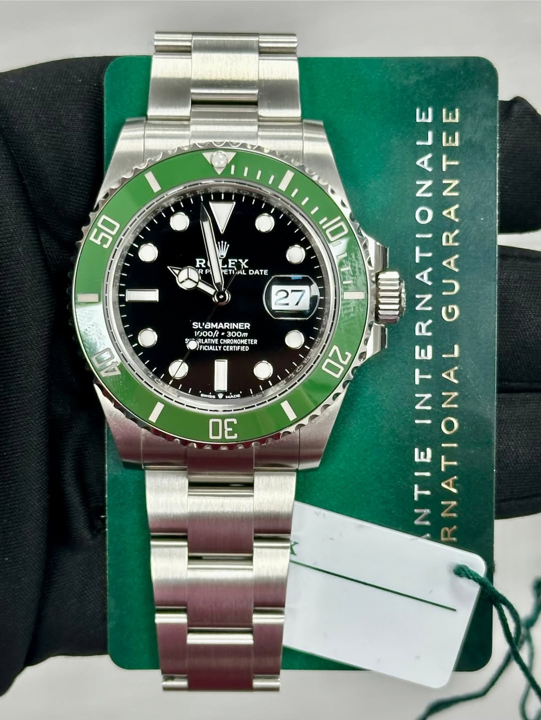May be an image of wrist watch and text that says '50 R EX ETLAL DATE SUAMARINER SL 1000/ -300M HRONOMHETE TER FICIALLY CERTIFIED CERTIRIES 40 من MACH 30 10 27 жp 20 INTERNAT…