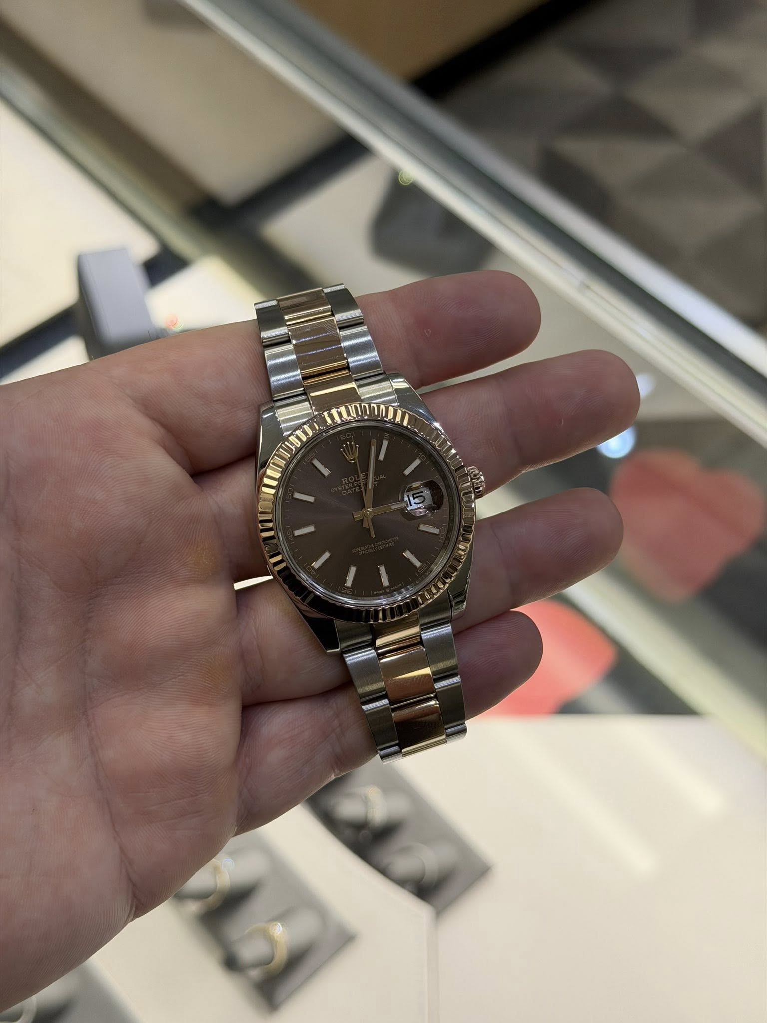 May be an image of wrist watch and text