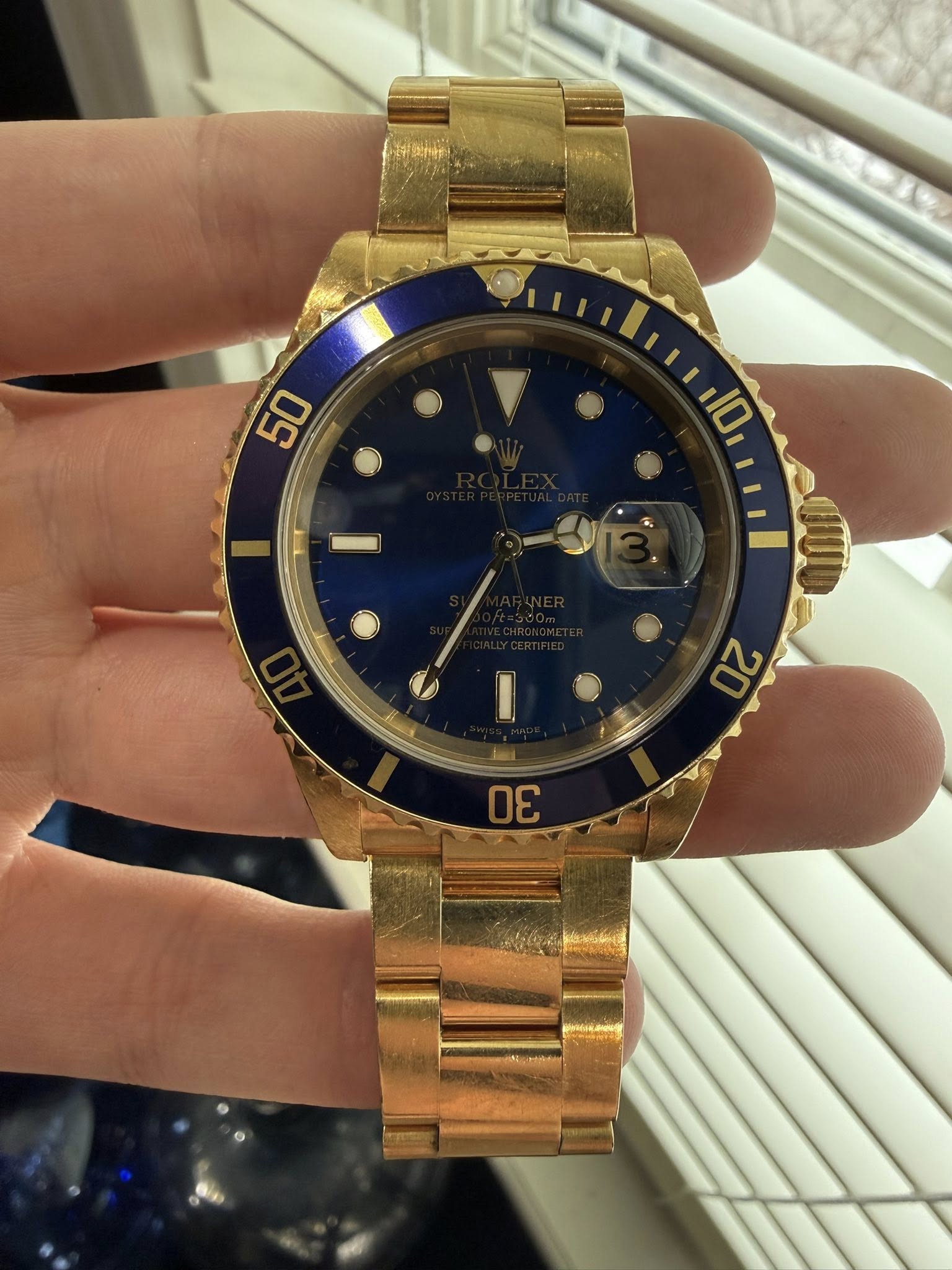 May be an image of wrist watch and text