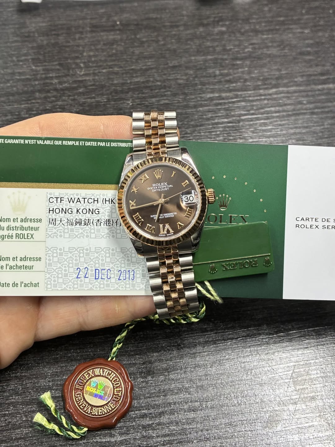 May be an image of wrist watch and text