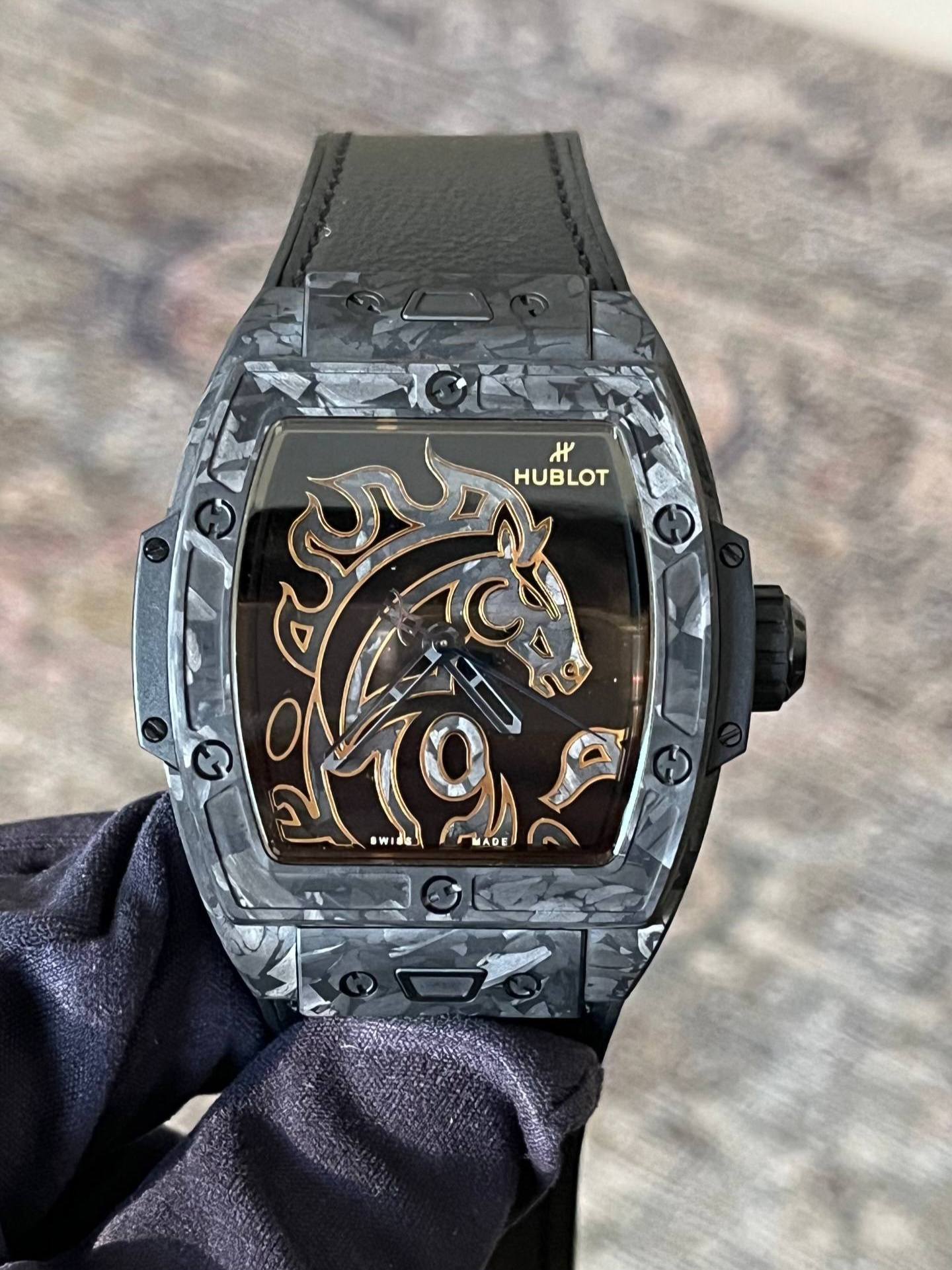 May be an image of wrist watch and text