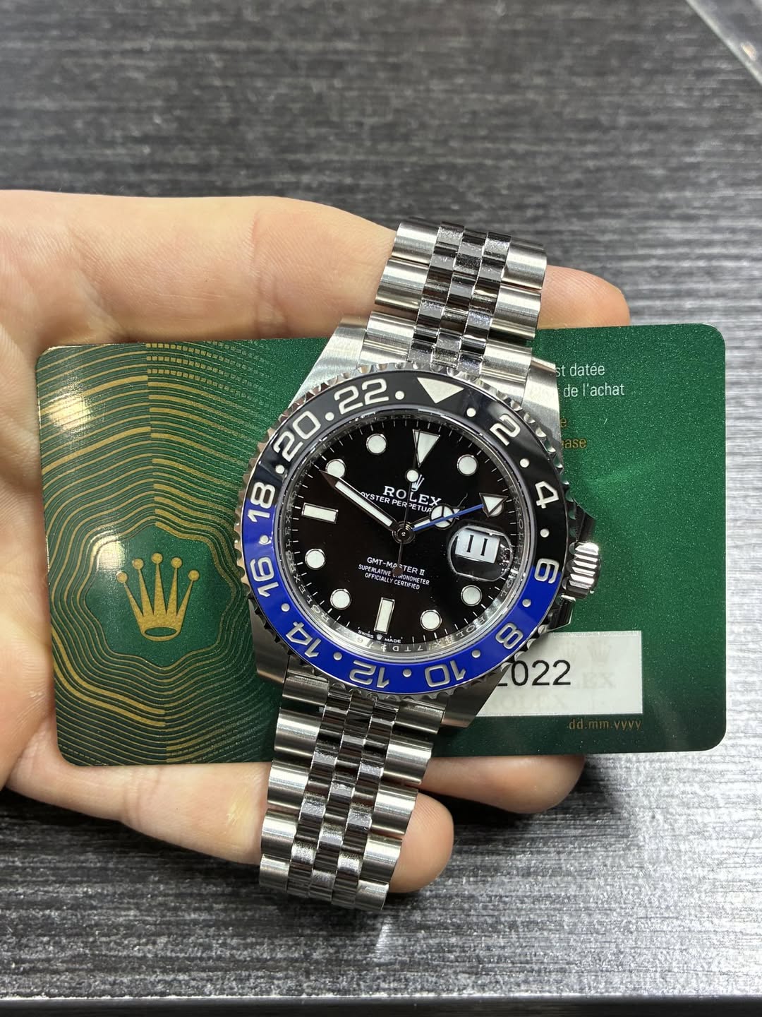 May be an image of wrist watch and text