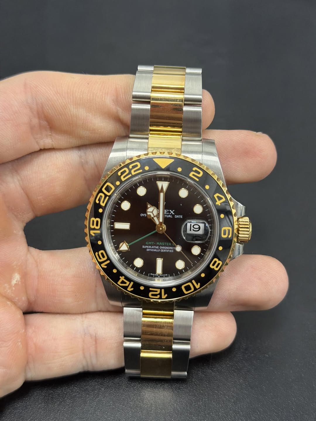 May be an image of wrist watch and text