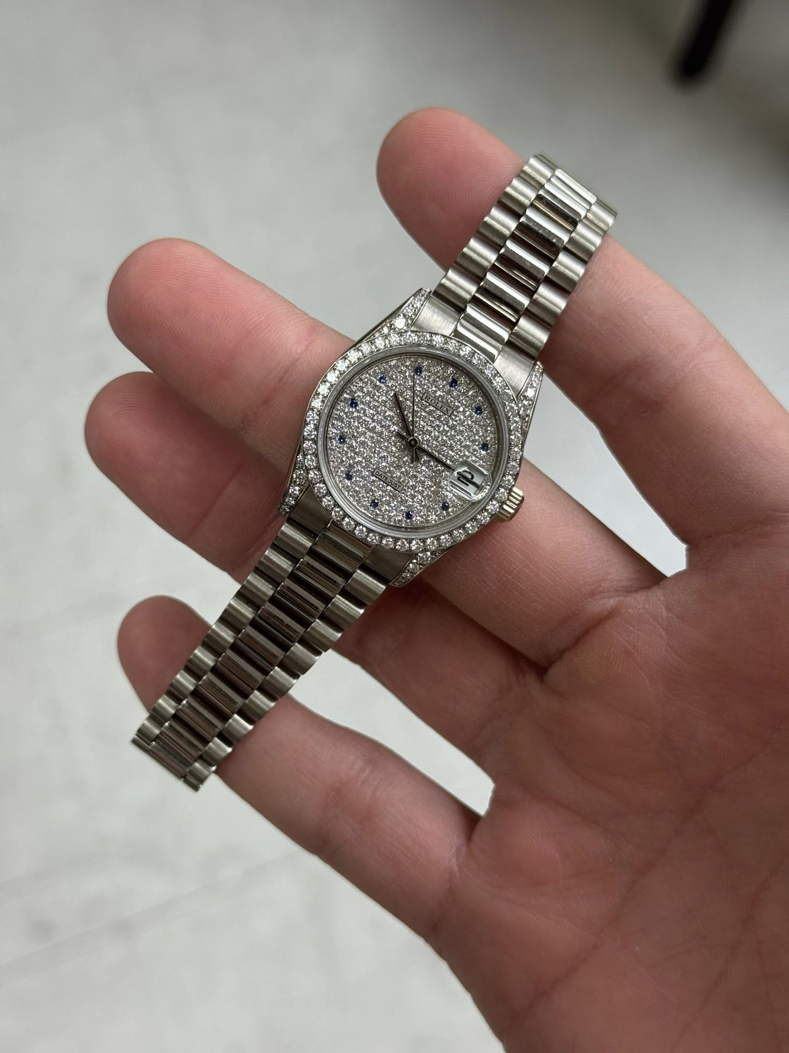 May be an image of wrist watch and text